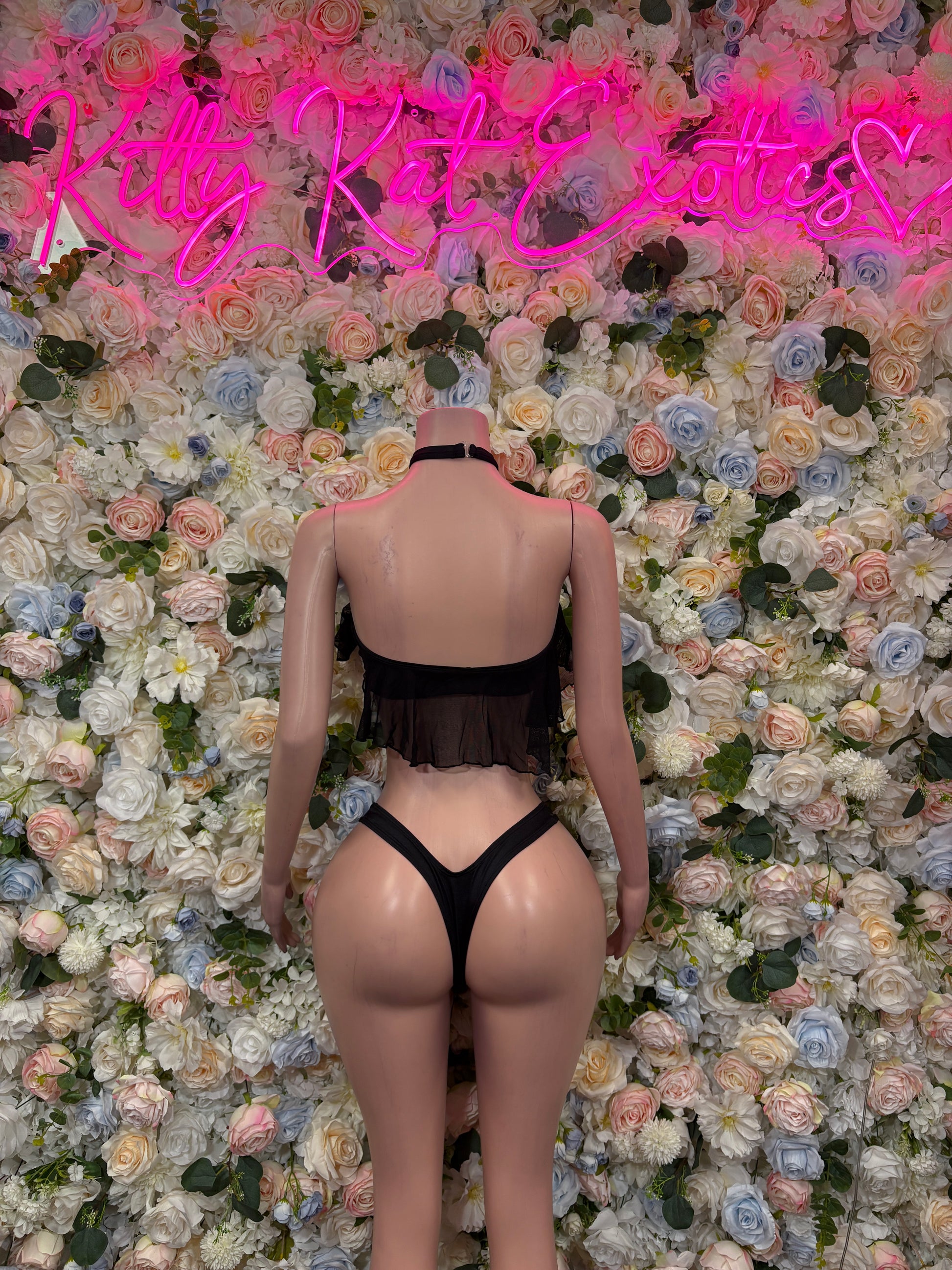Black ruffle crop top bikini with back view and high-cut bottoms