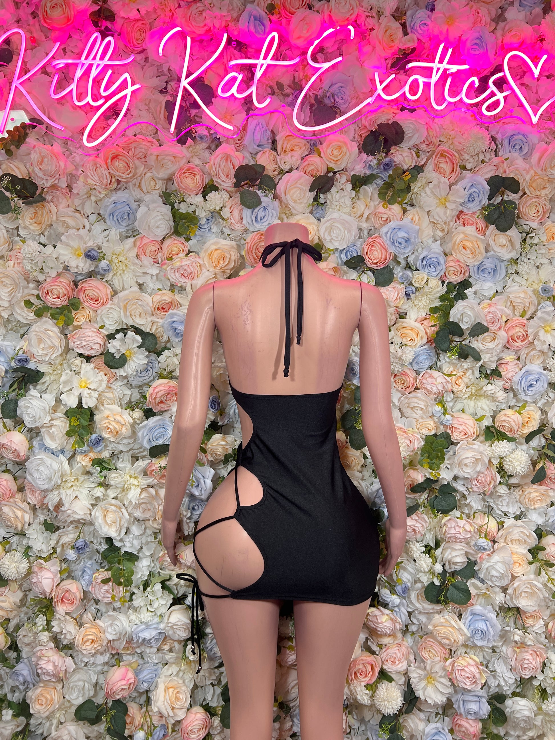 Black cutout halter mini dress with strappy back ties, bodycon fit