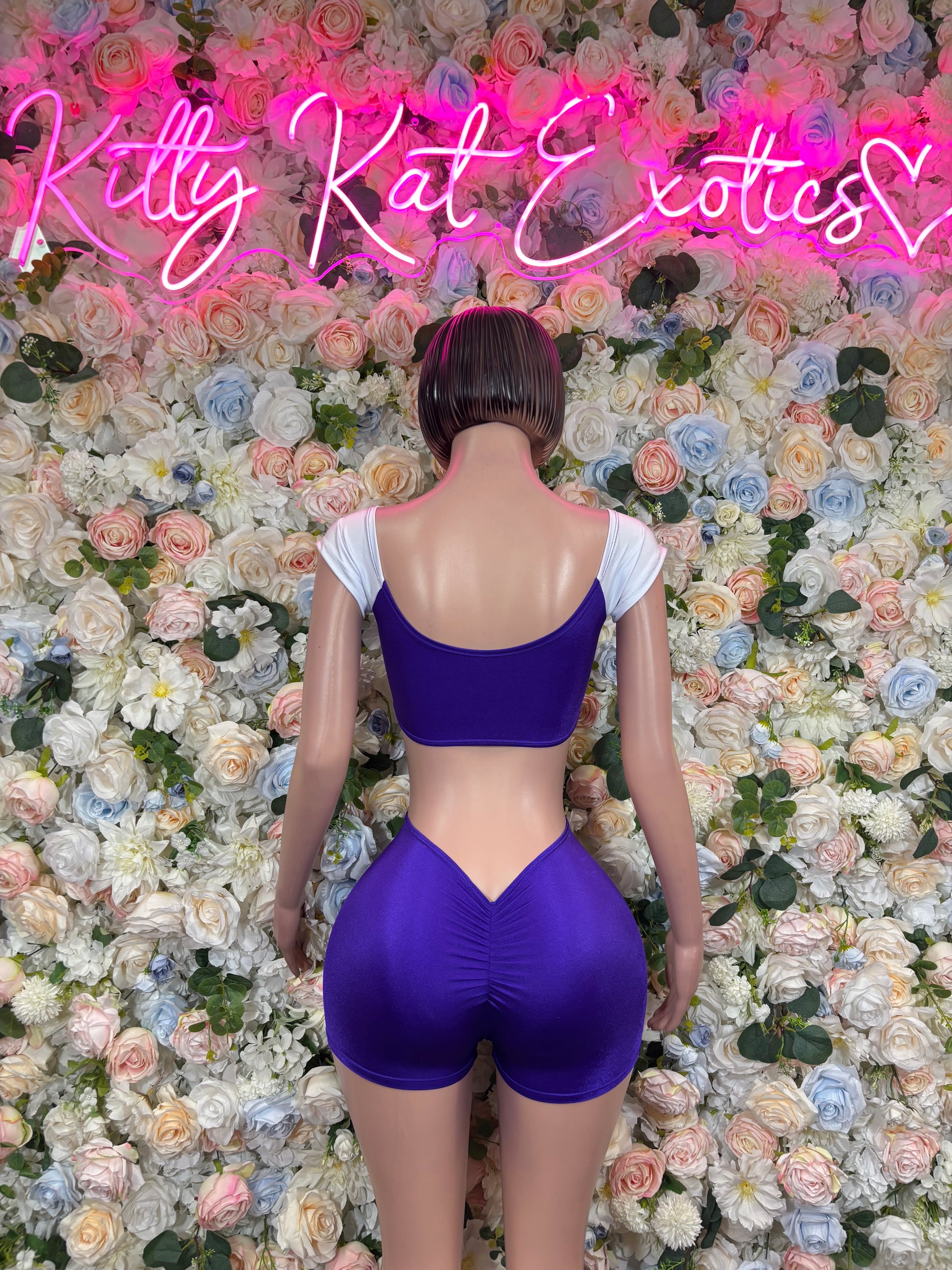 Purple satin-style short bodysuit costume, open back with halter straps
