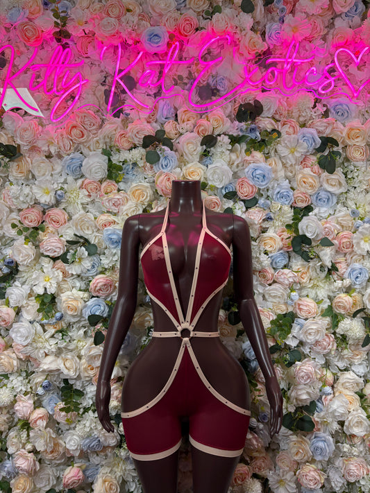 Burgundy bodysuit with white strappy harness and high-cut legs