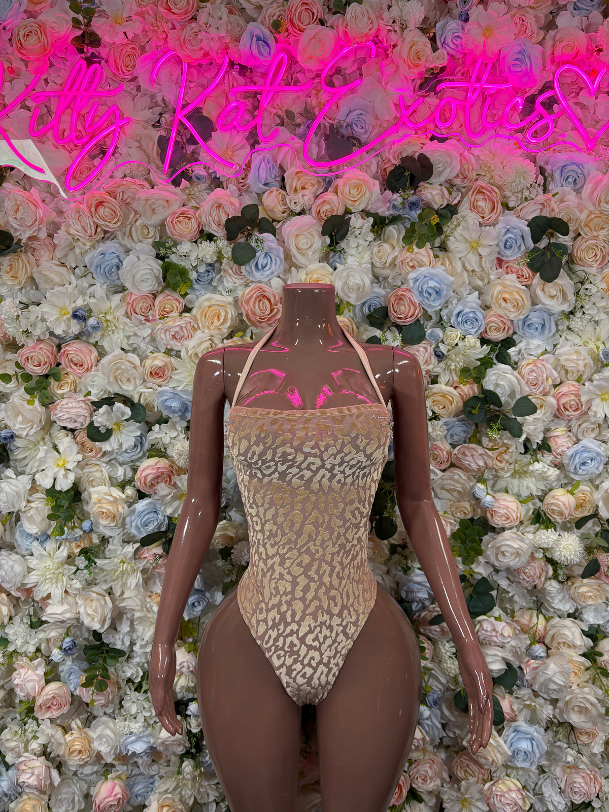Nude leopard-print one-piece bodysuit with high-cut, thong-style bottom