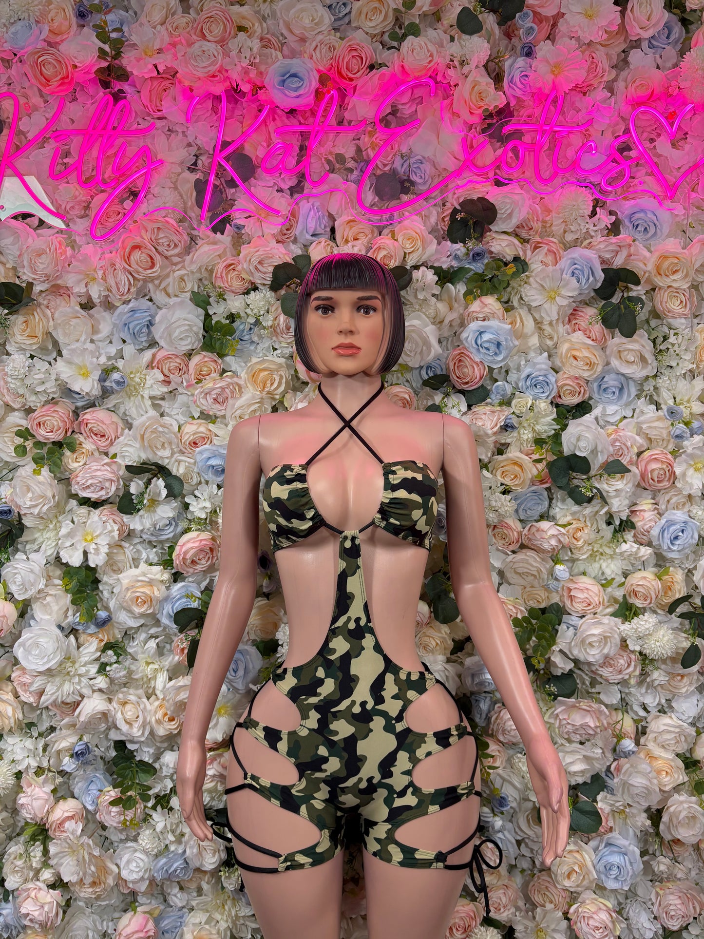 Camo print bodysuit with black strappy halter top and high-leg bottoms