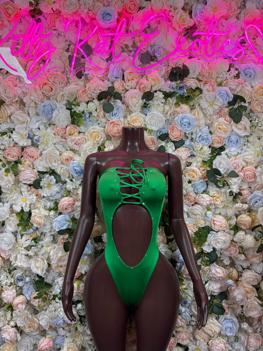 Green dancewear bodysuit with lace-up front and high-cut leg