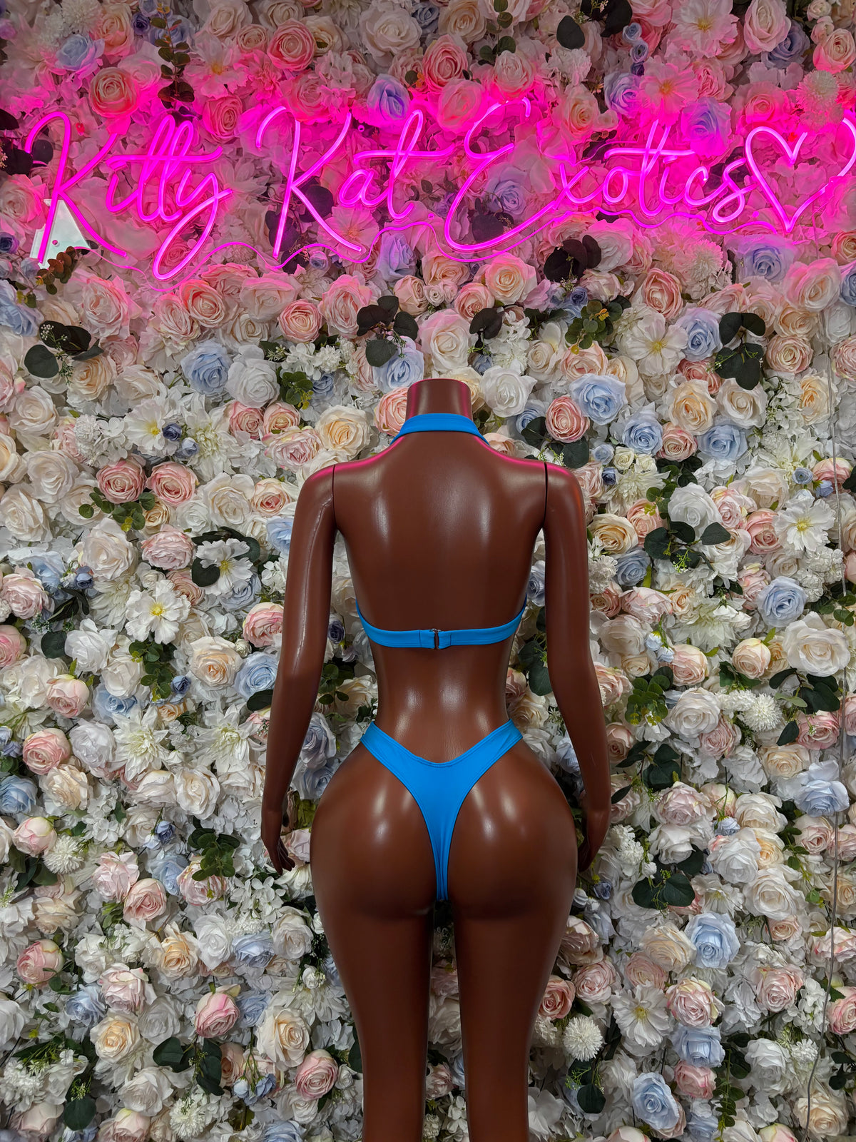 Blue shimmer backless bikini with thin straps and high-cut bottoms