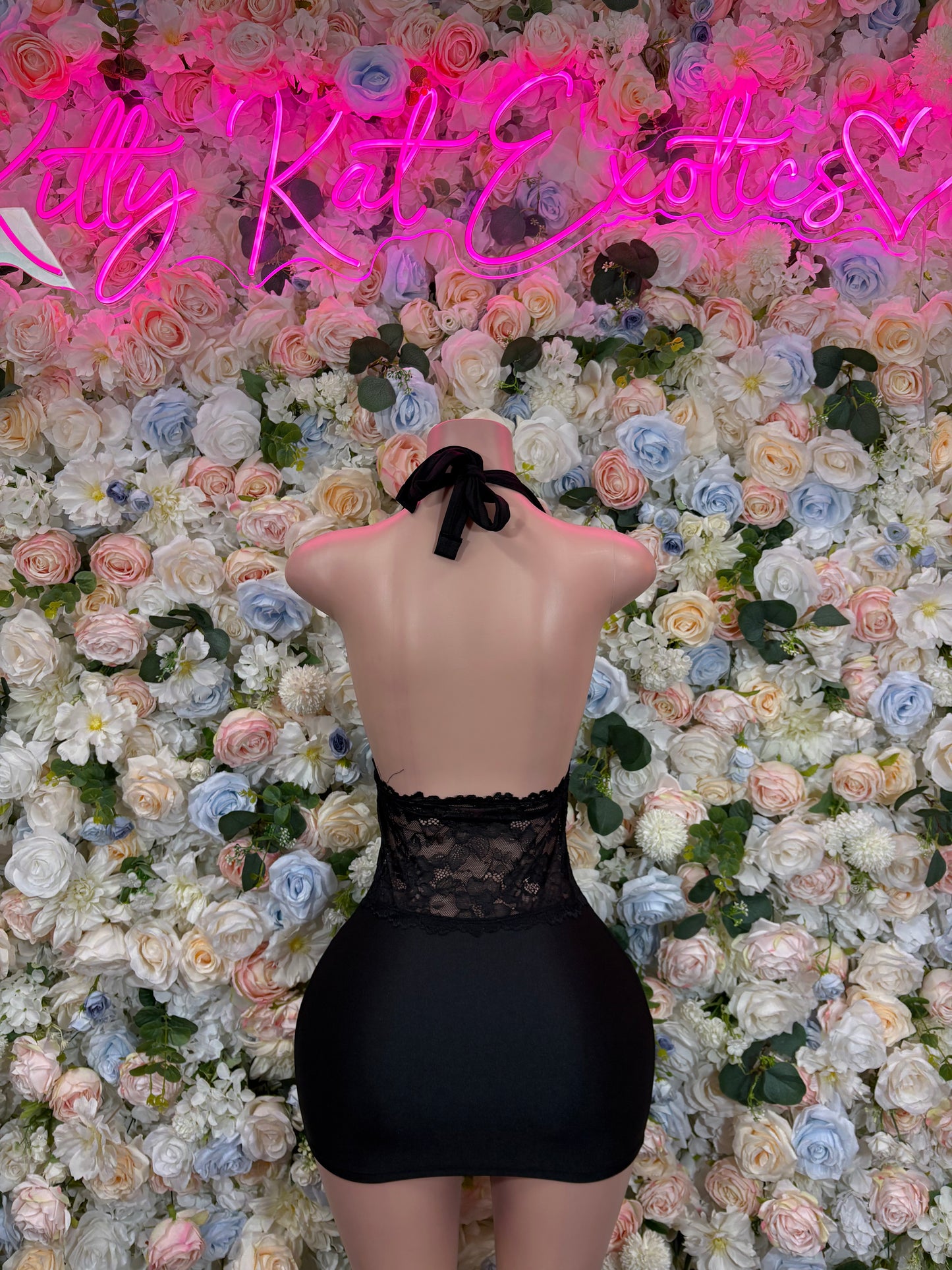 Black lace halter mini dress with open back and tie at neck