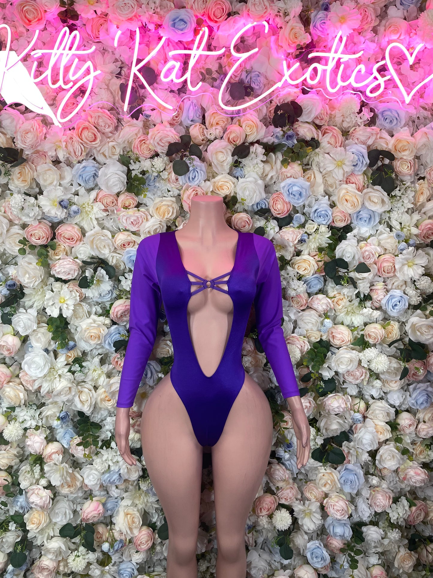 Purple long-sleeve bodysuit with V-back cutout and crisscross tie