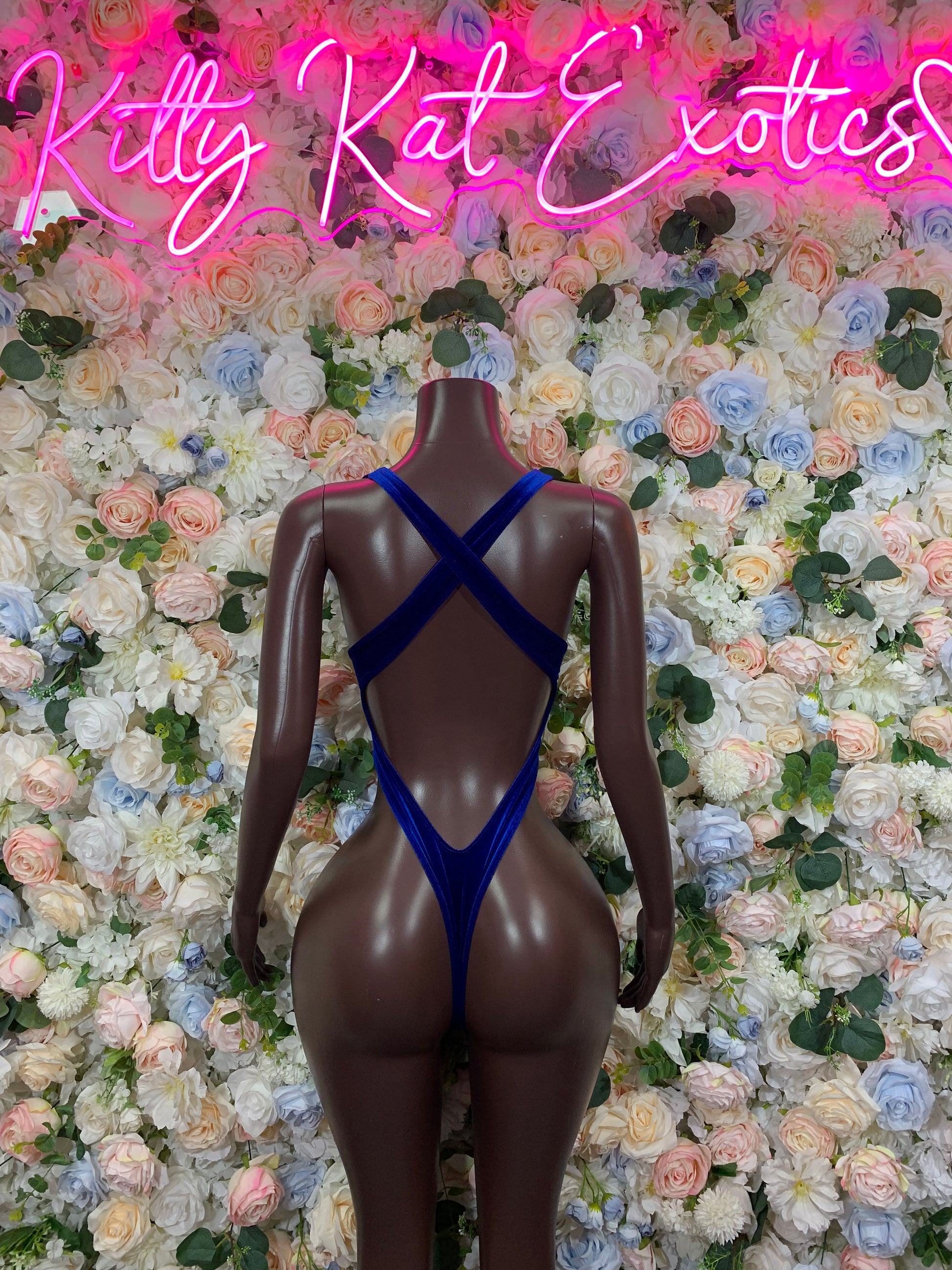 Dark blue velvet one-piece bodysuit with crisscross back straps and deep back V cut