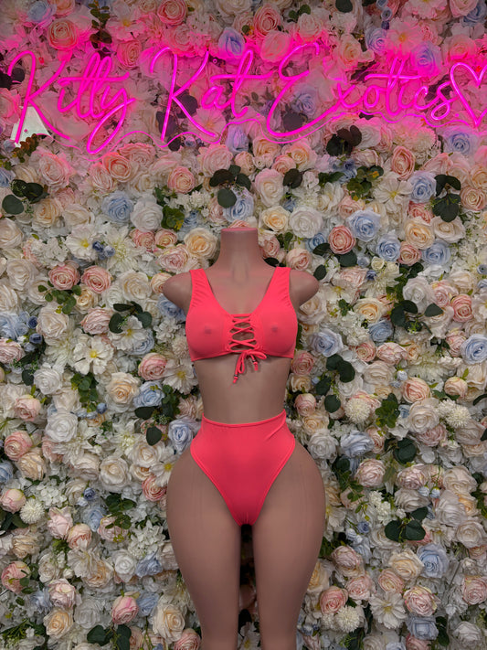Coral two-piece rave outfit with lace-up bandeau top and high-cut bottoms