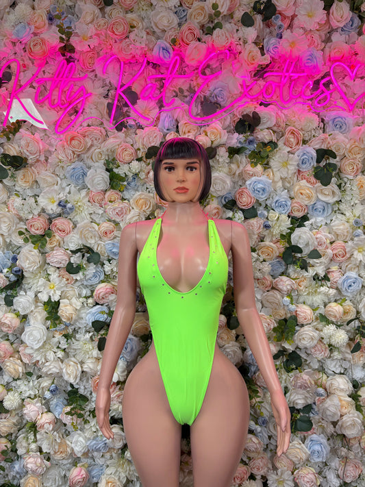Neon green two-piece dancewear set with strappy bodysuit and high-cut bottoms