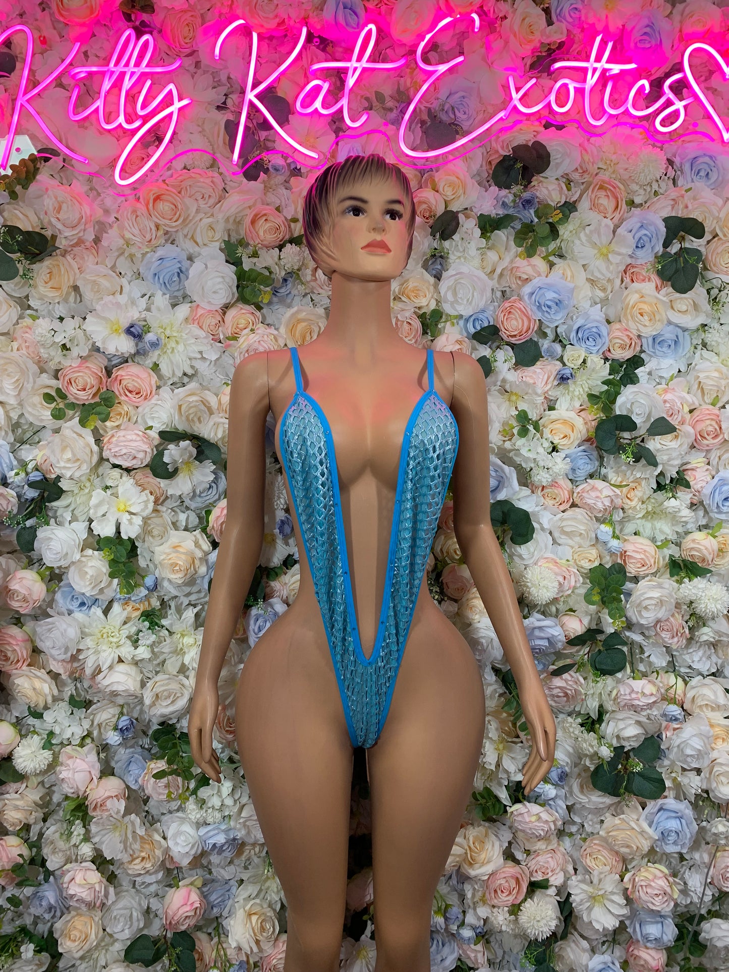 Baby blue fishnet bodysuit with deep V front and high-cut legs