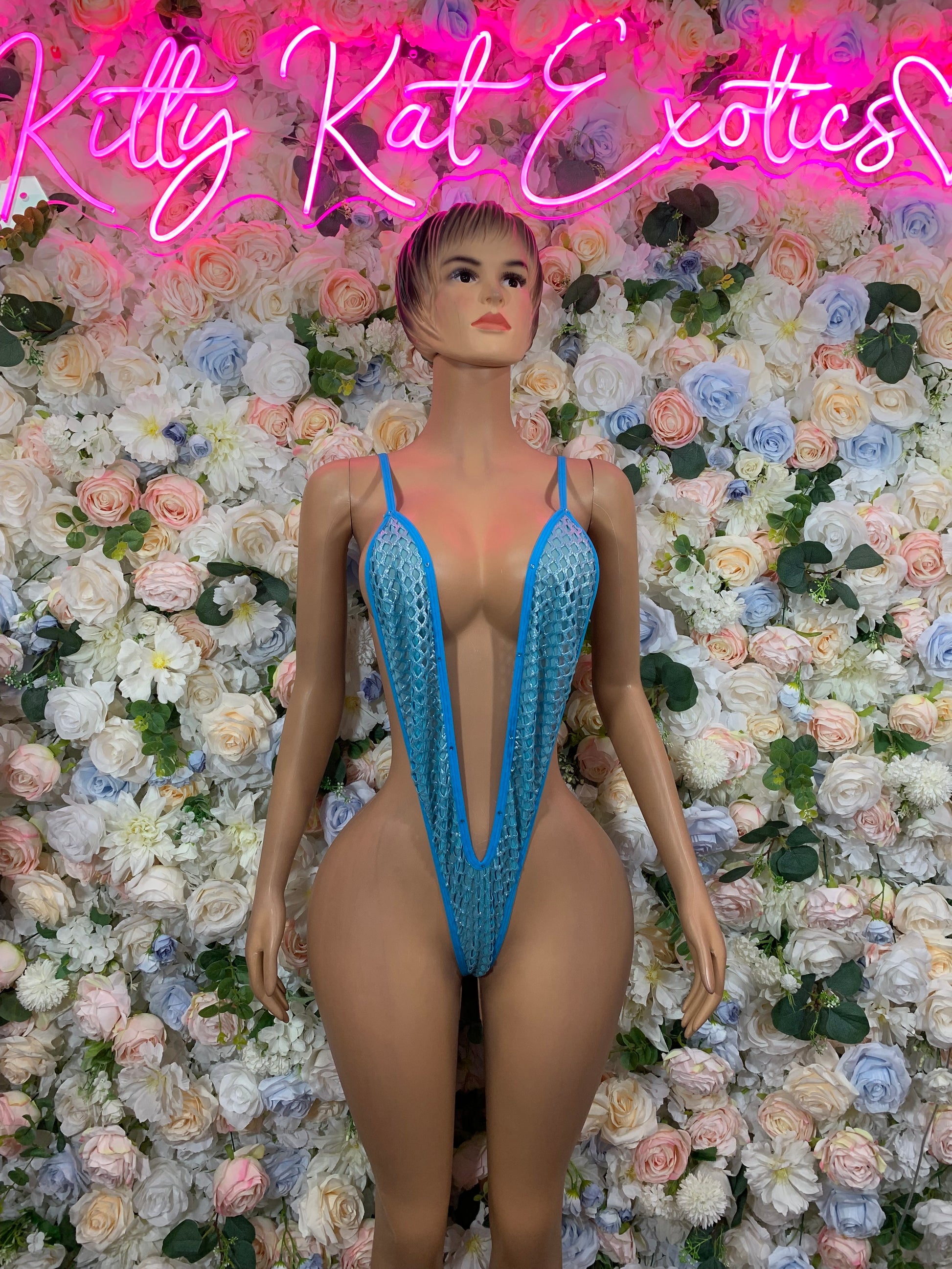 Baby blue fishnet bodysuit with deep V front and high-cut legs