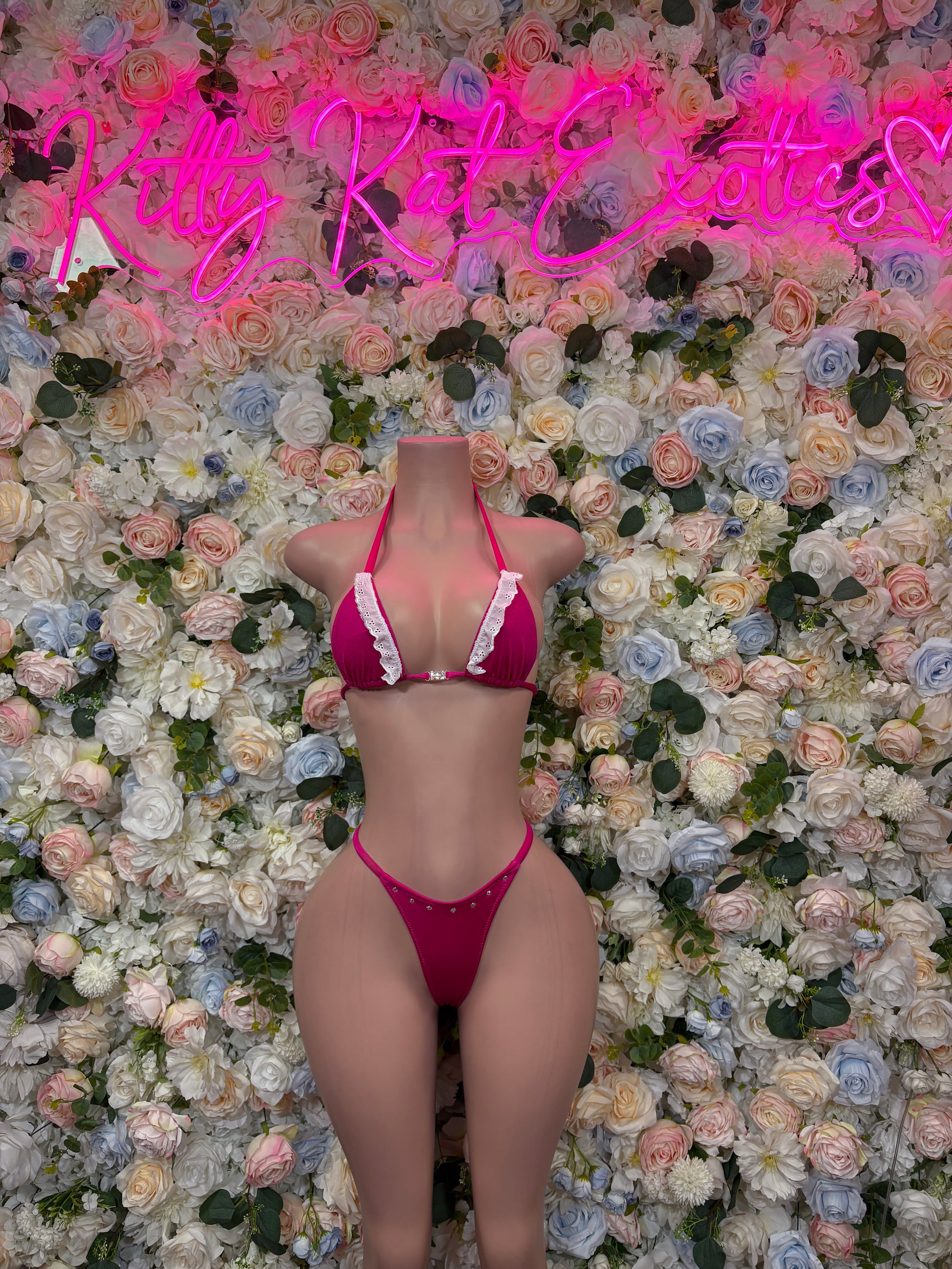 Pink two-piece rave bikini with triangle top and high-cut thong-style bottoms