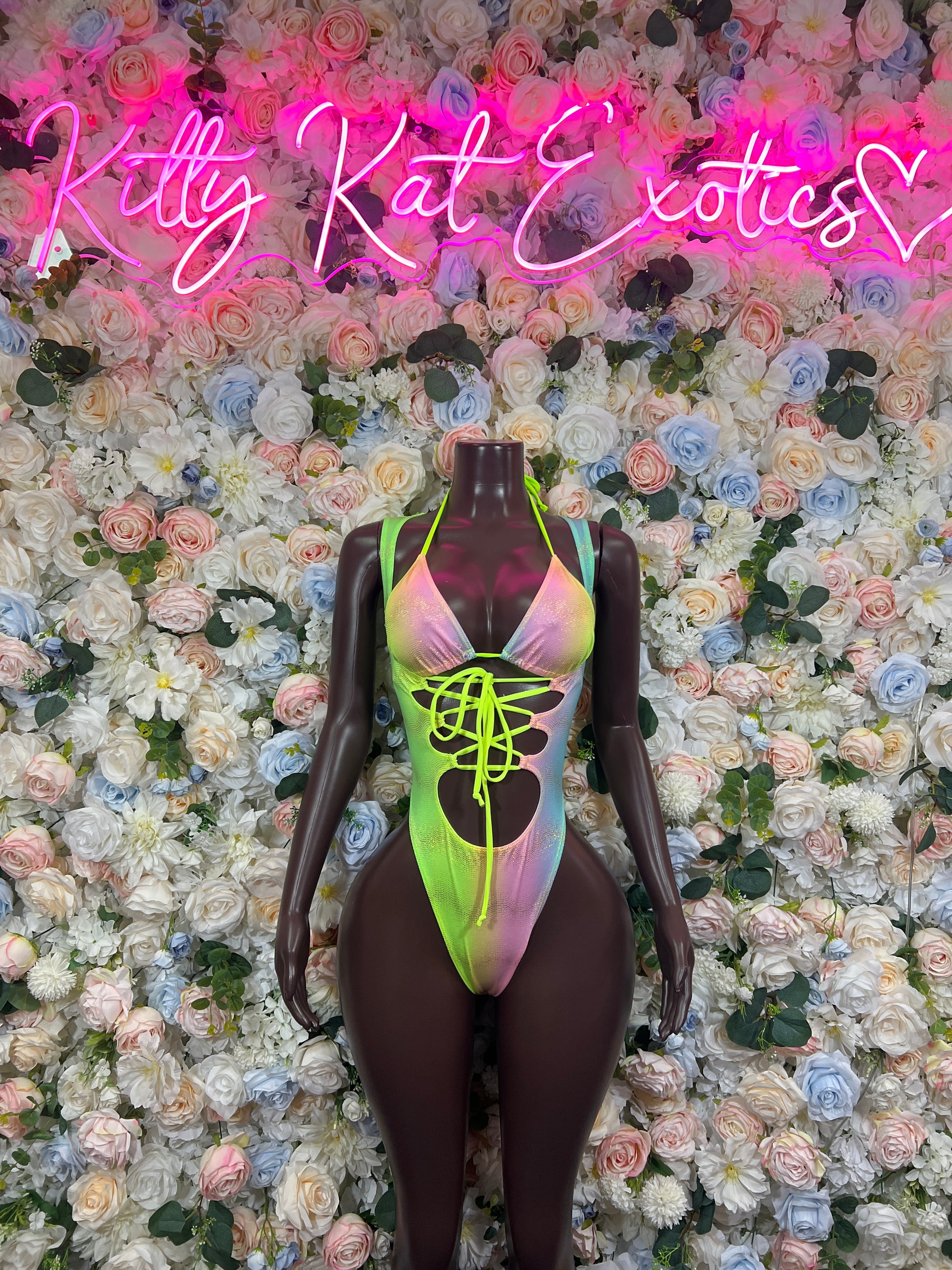 Holographic neon lace-up bodysuit with halter neckline and high-cut legs, front view