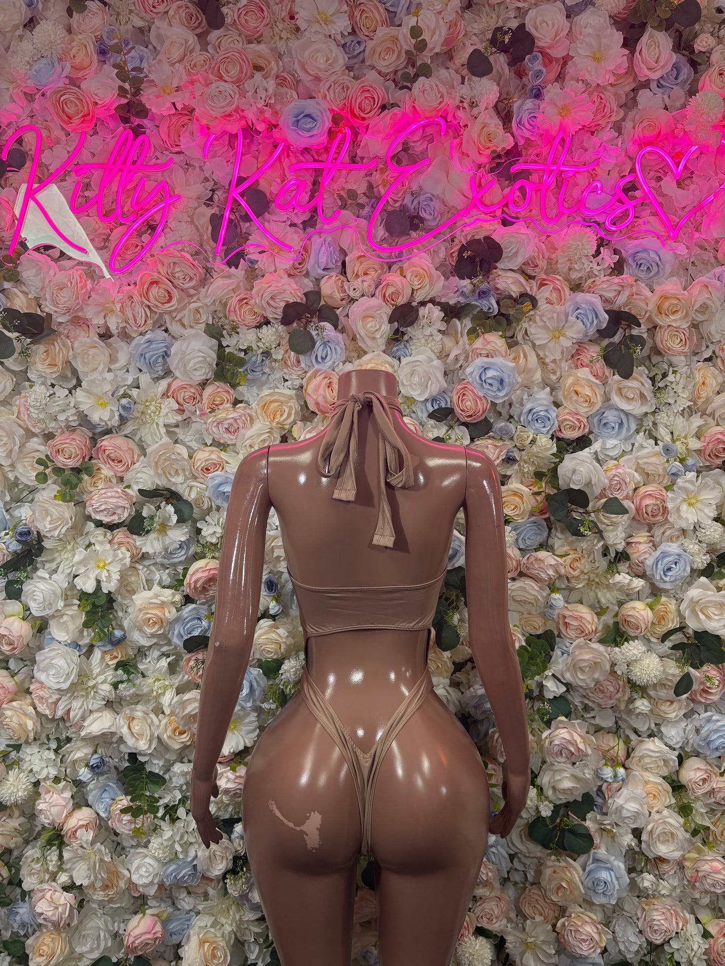 Tan halter one-piece bodysuit with ruched straps and glossy front