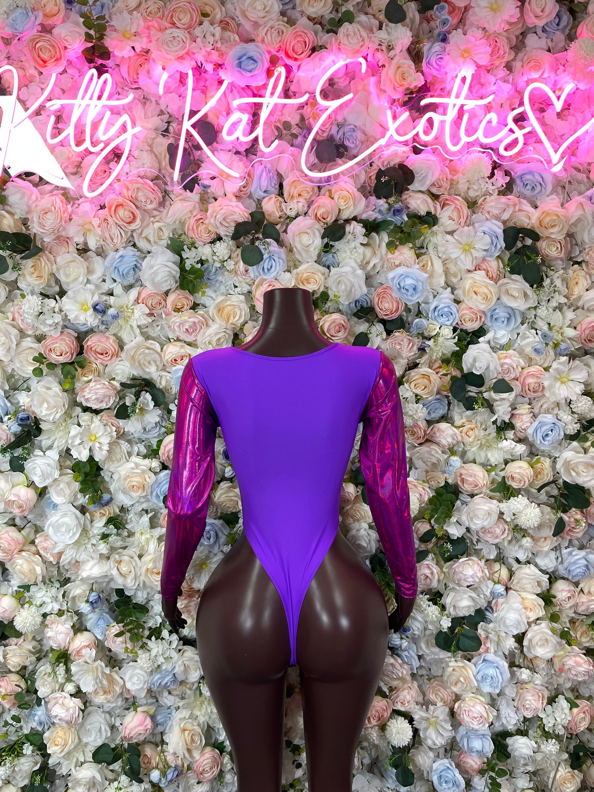 Purple thong bodysuit with long sleeves and keyhole back