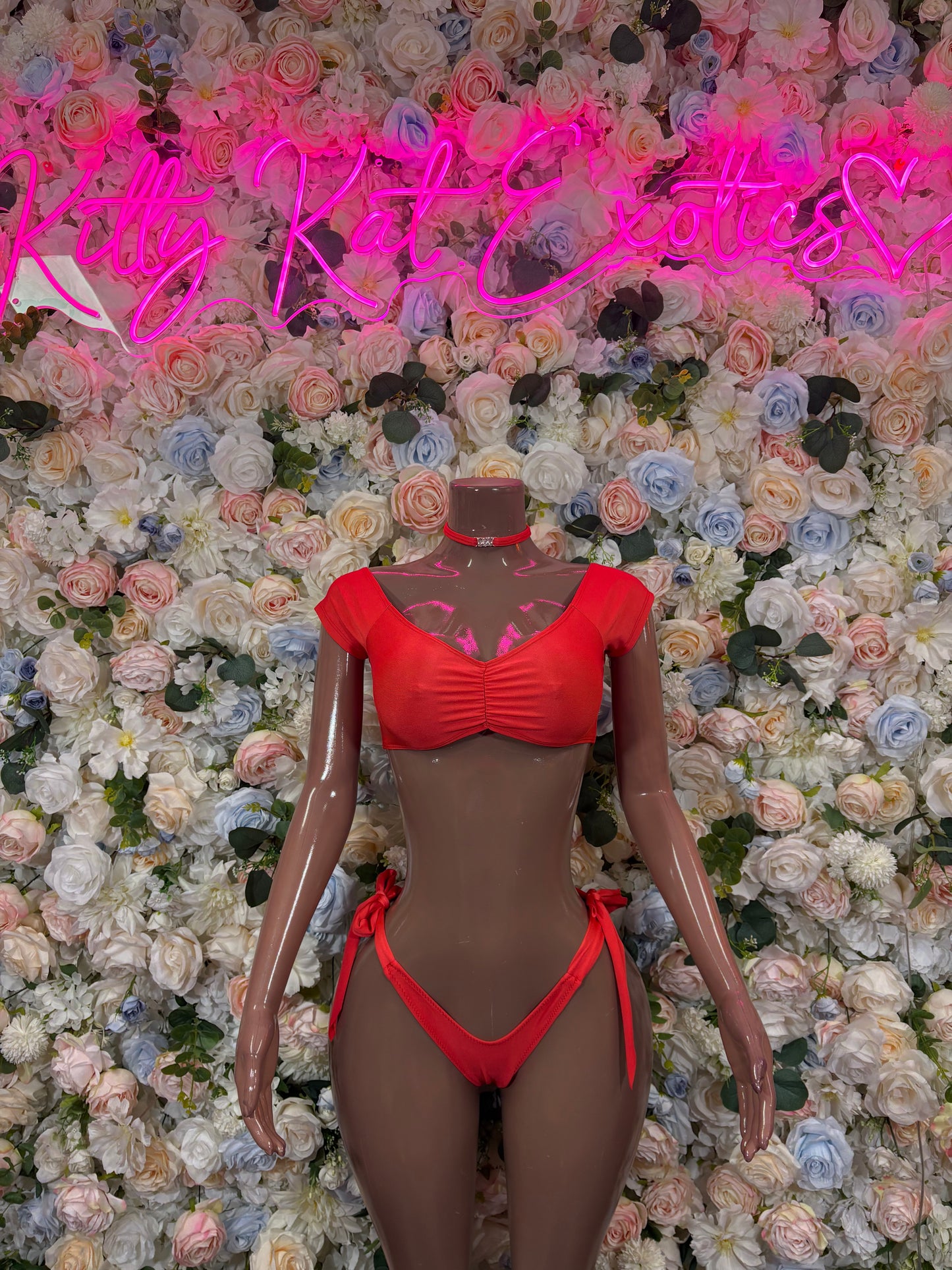 Red bikini two-piece set with ruched triangle bra and tie-side thong bottoms