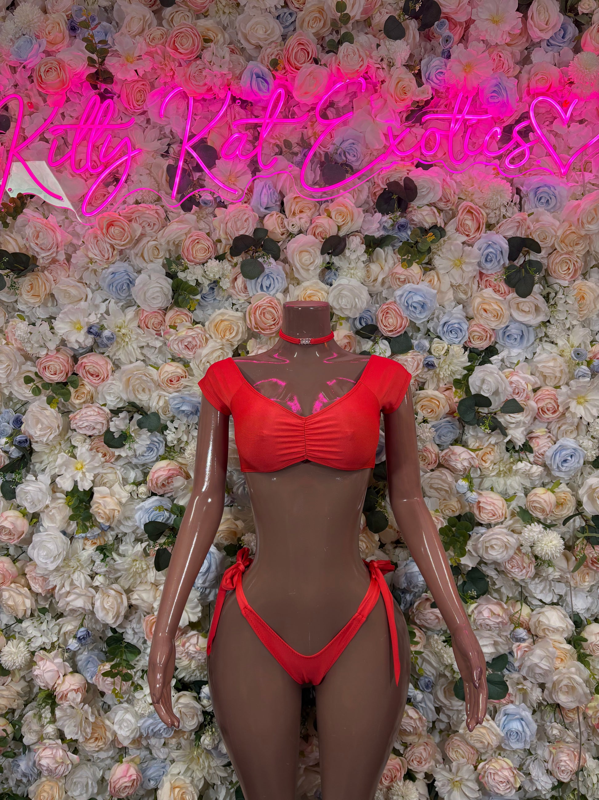 Red bikini two-piece set with ruched triangle bra and tie-side thong bottoms