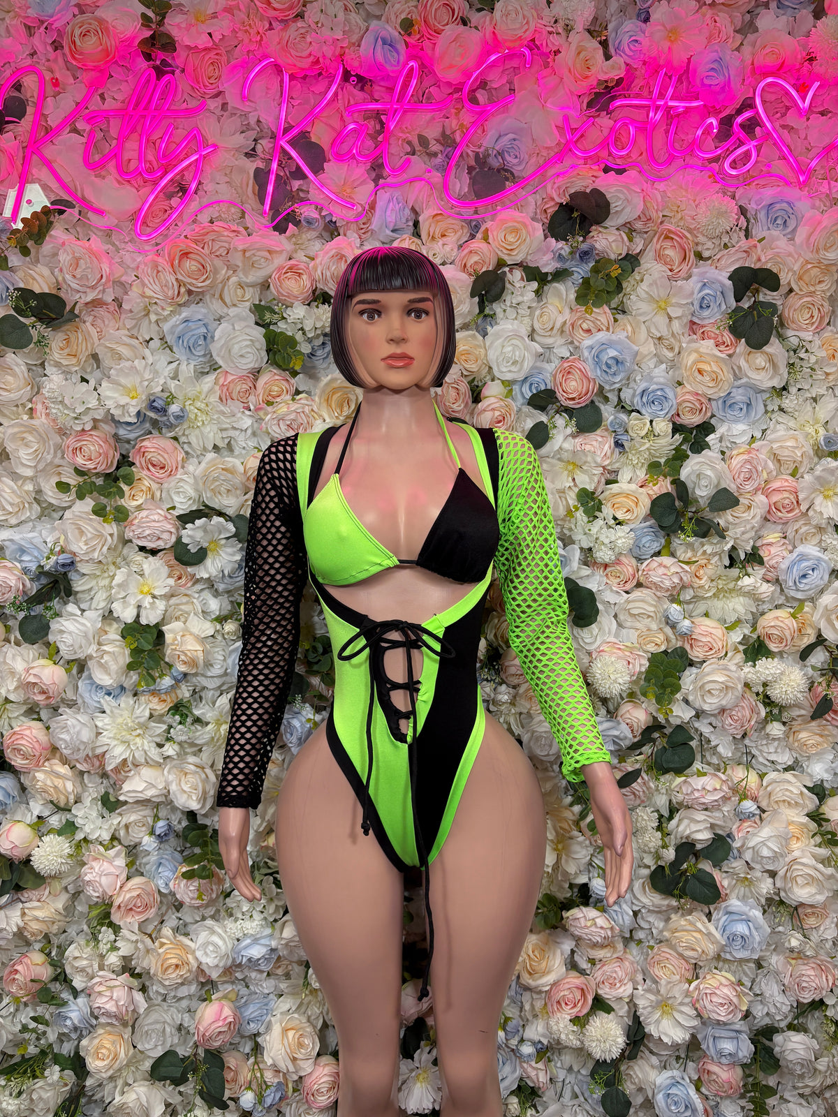 Neon green & black lace-up bodysuit with plunging V-neck and fishnet long sleeves