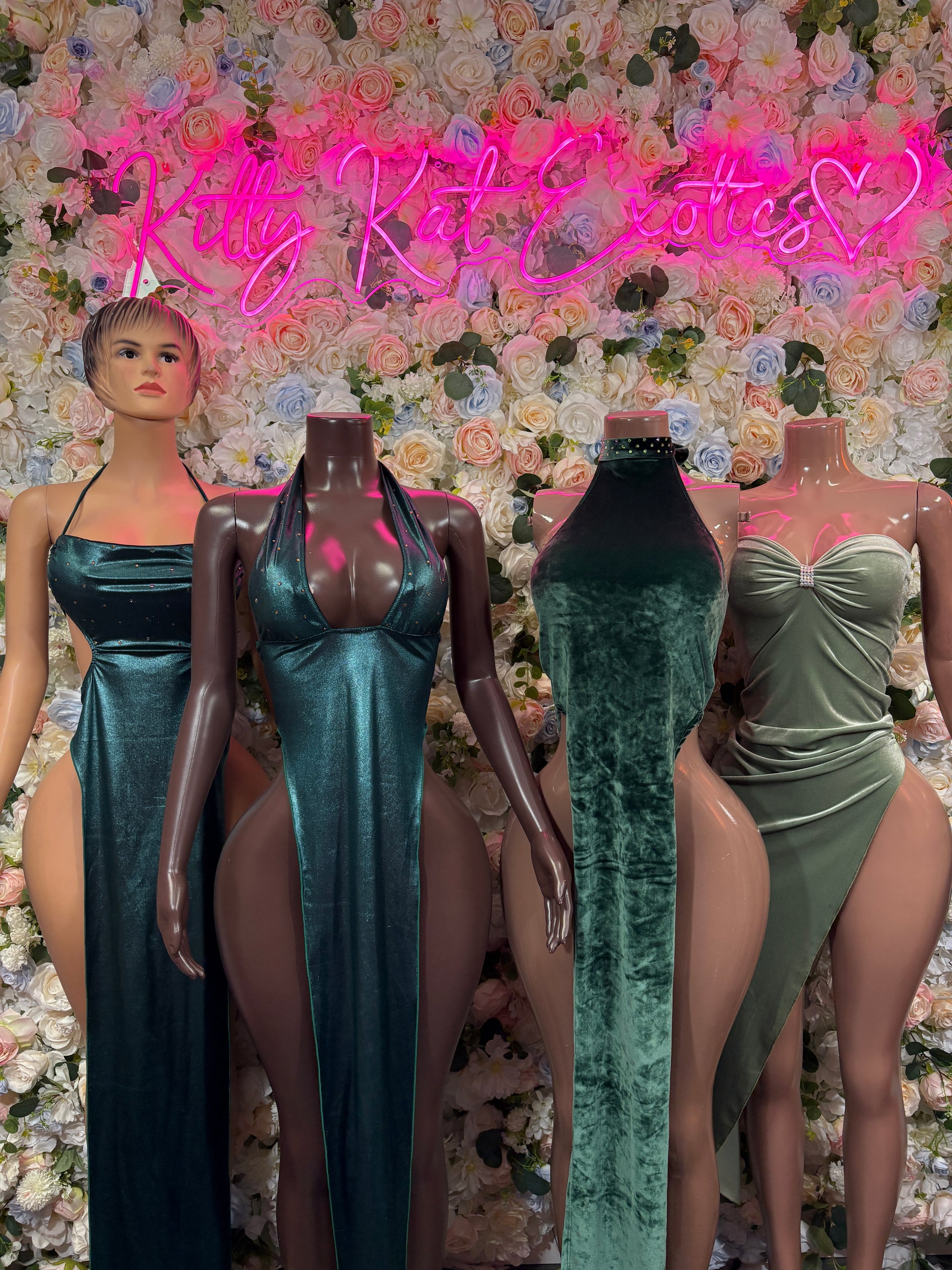 Teal satin maxi gown with deep V front and open back, sleeveless, on model