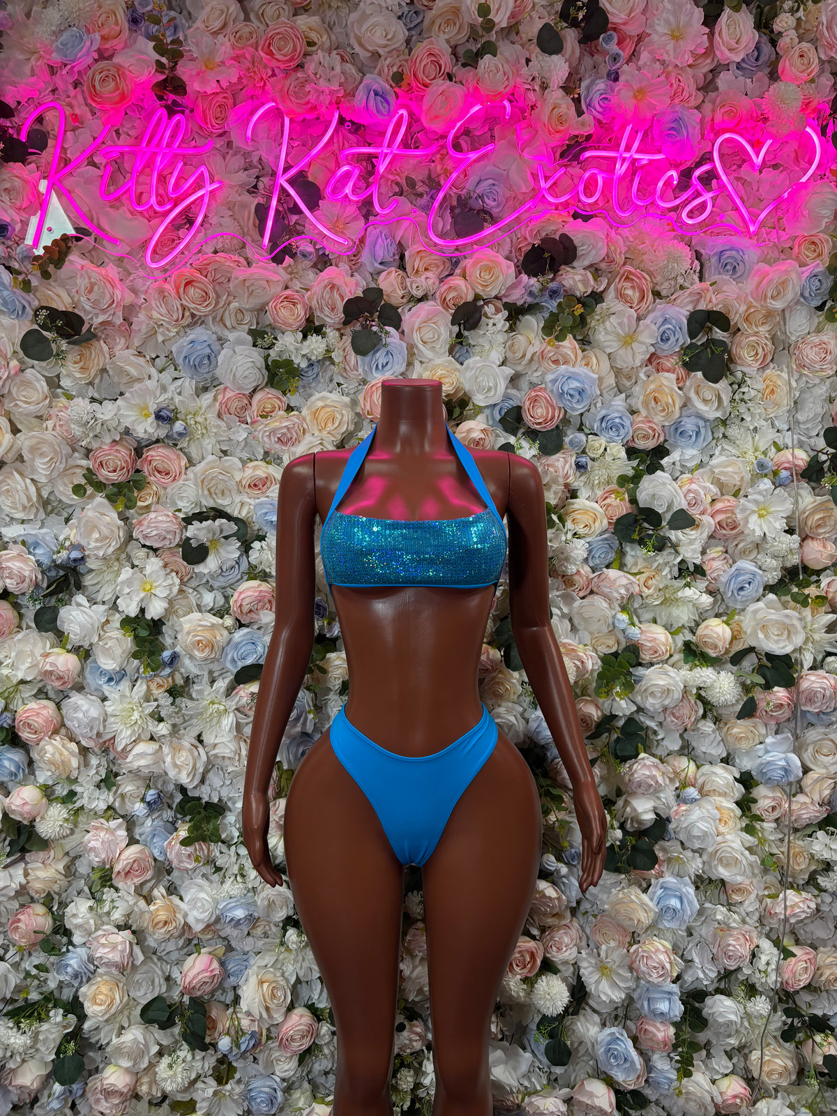 Blue shimmer two-piece bikini set with halter straps and high-cut bottoms