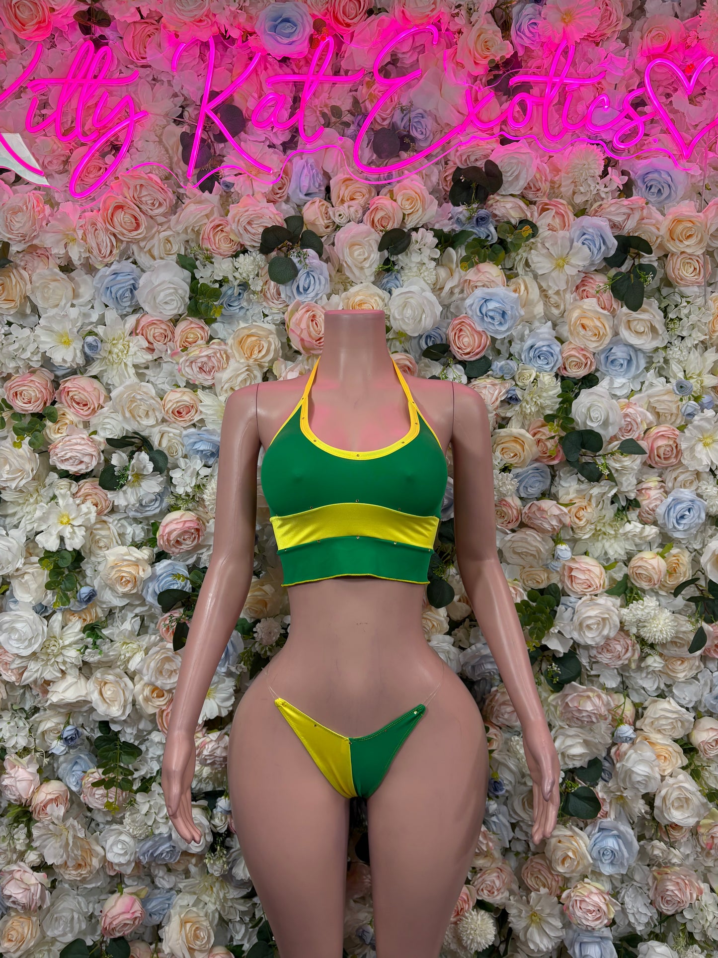 Green and yellow two-piece bikini swimsuit with crop top and matching bottoms