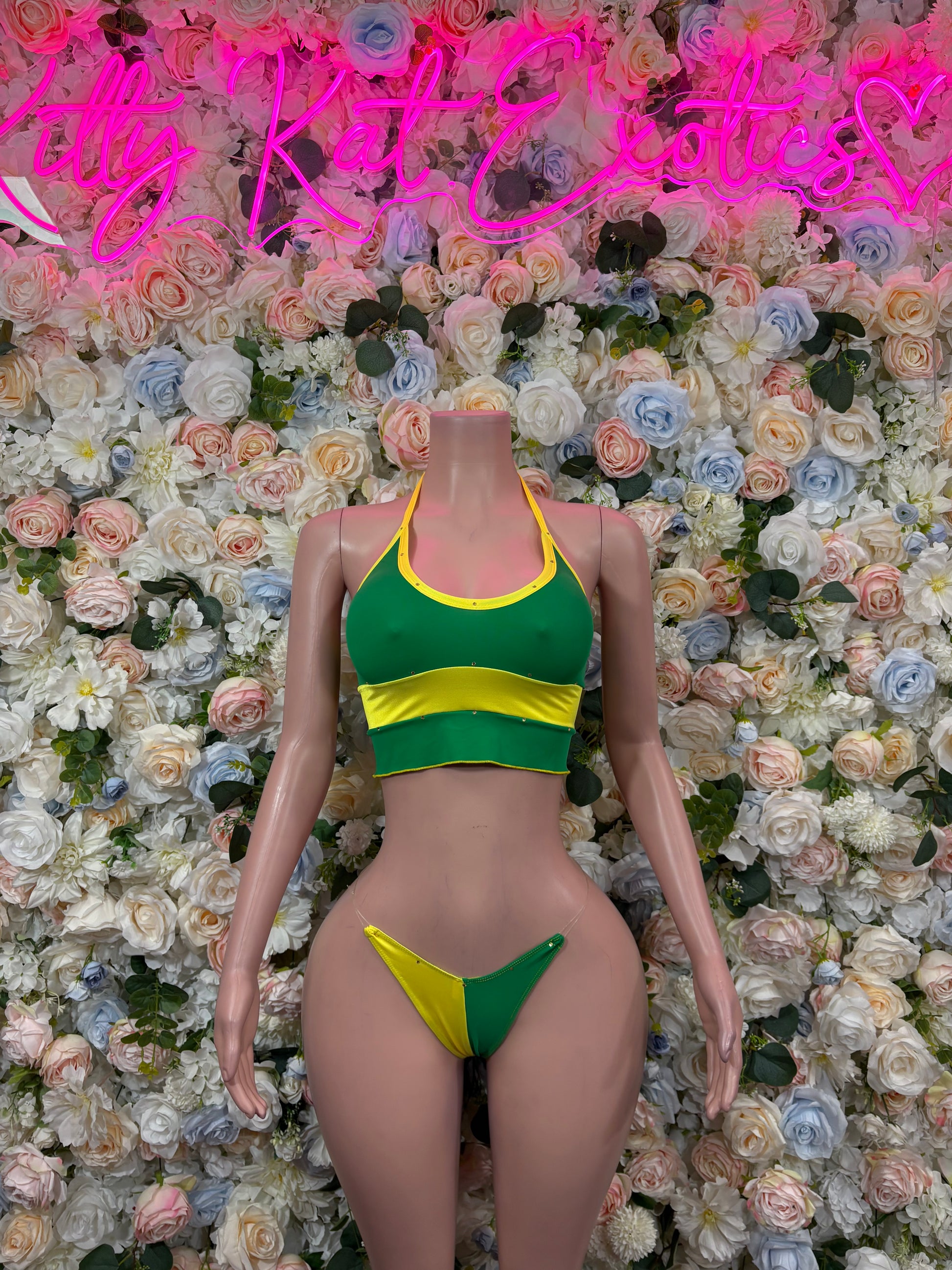 Green and yellow two-piece bikini swimsuit with crop top and matching bottoms