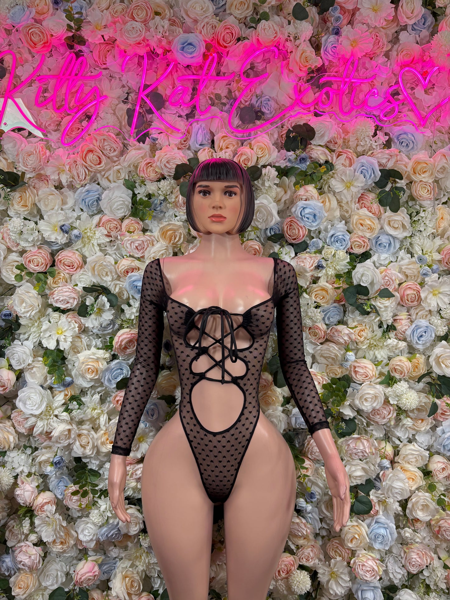 Black mesh heart bodysuit with long sleeves and front lace-up cutout