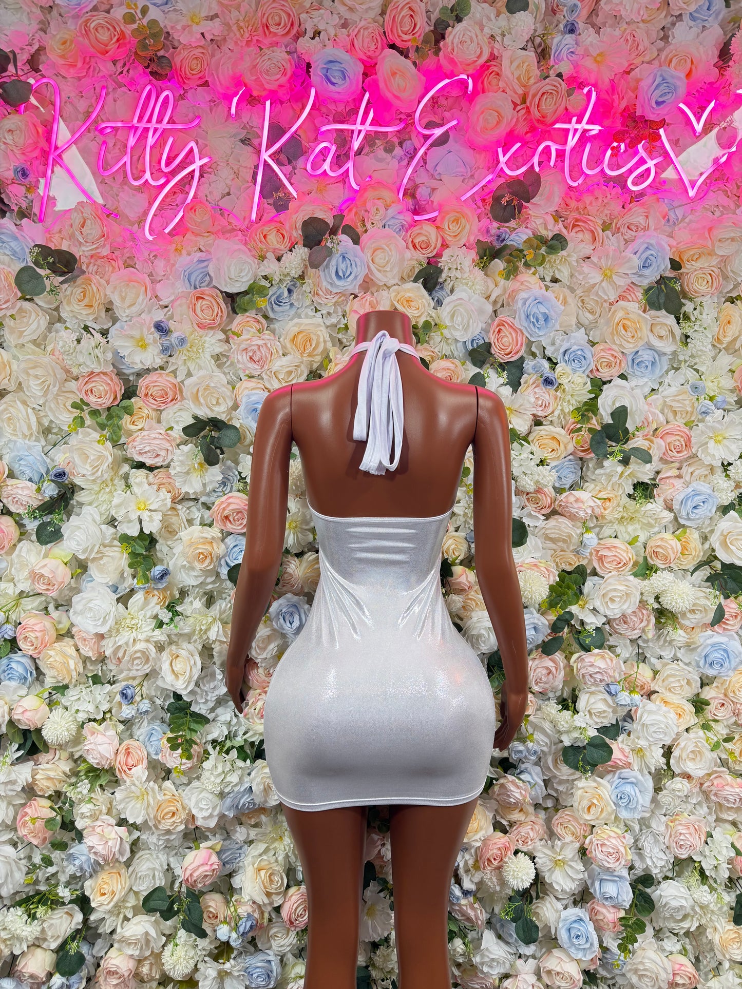 White metallic backless mini dress with halter straps and tie-back detail