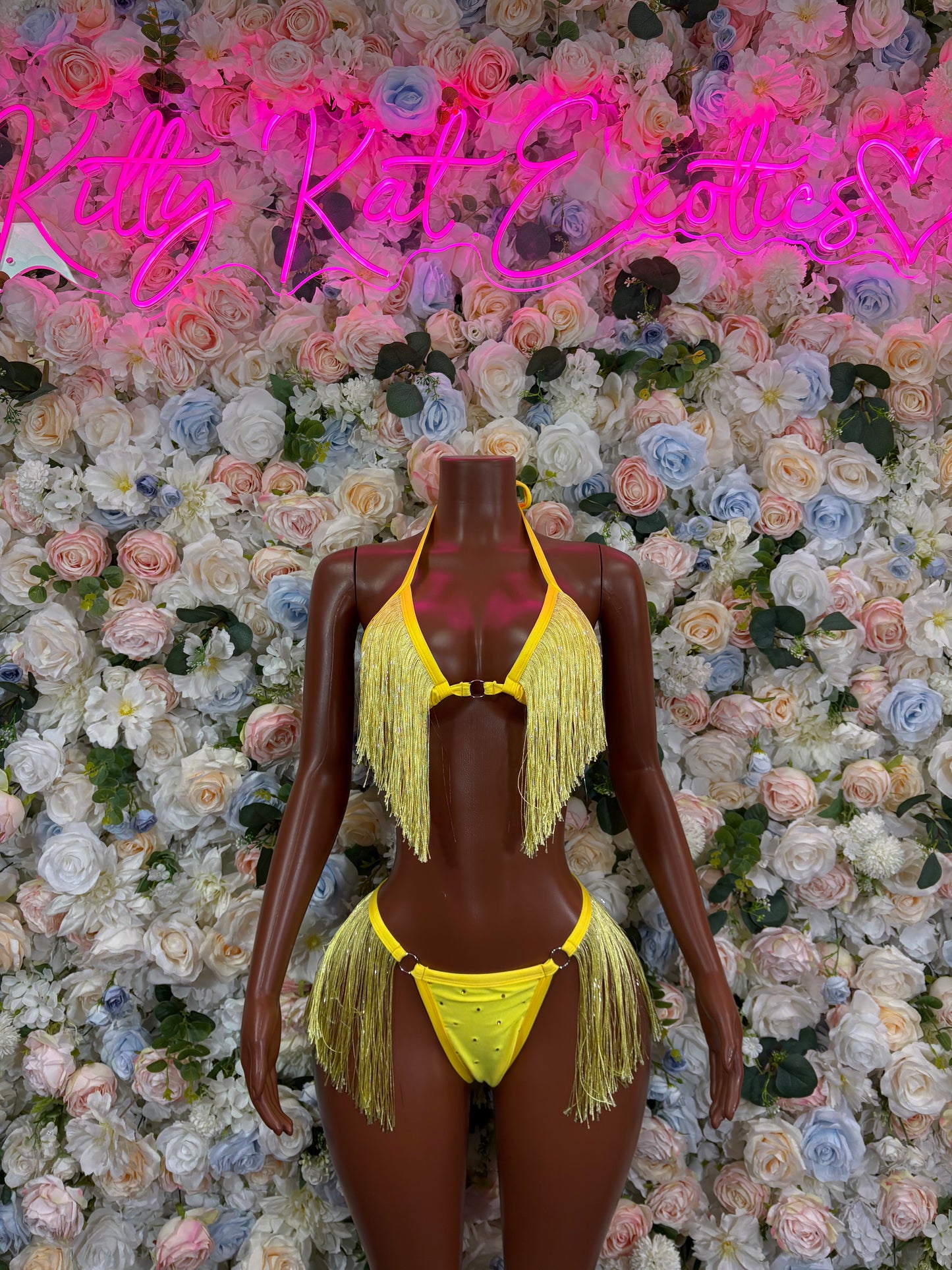 Yellow fringe two-piece festival set: triangle bikini top and matching bottoms on mannequin