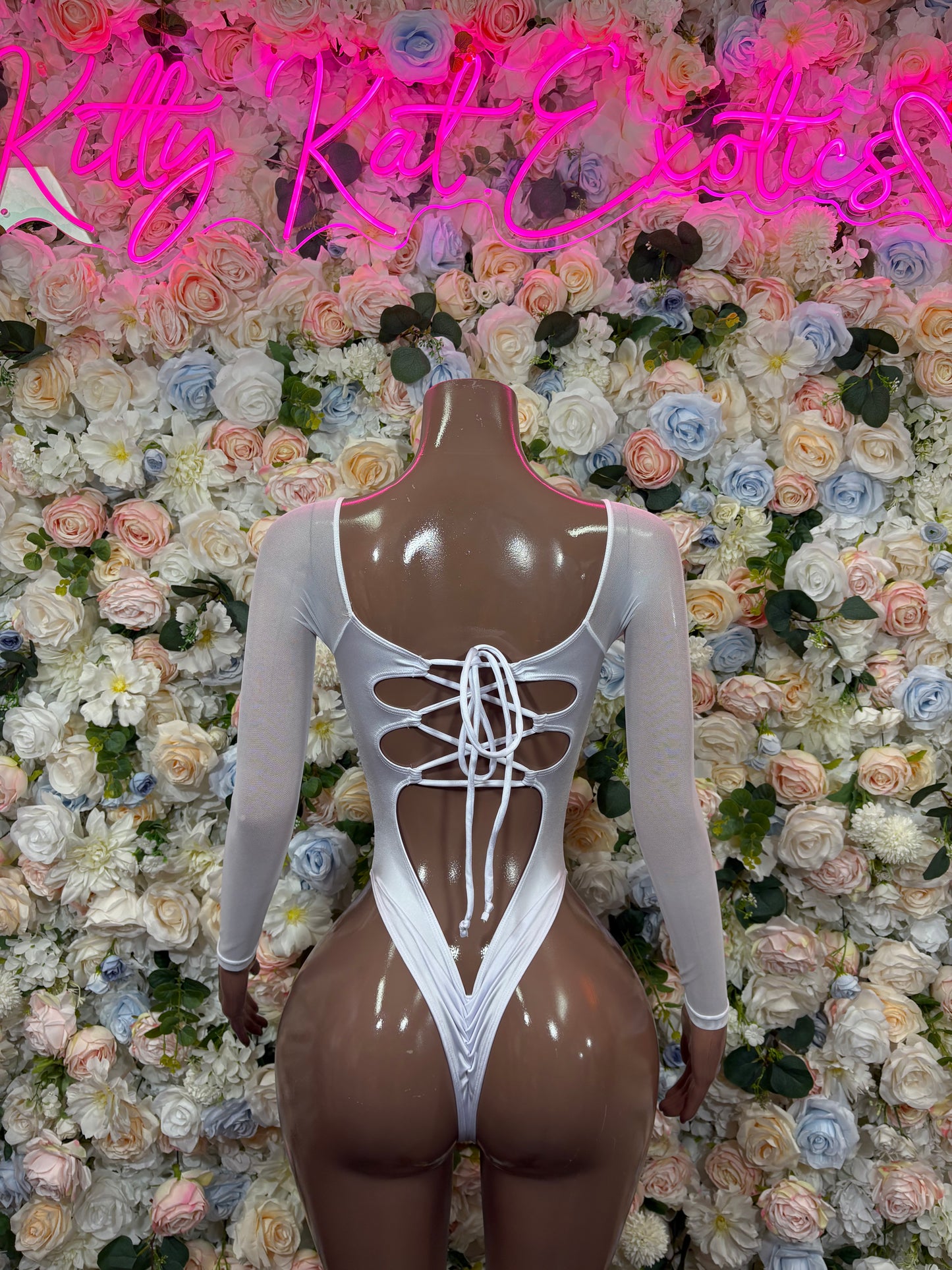 Rainbow holographic bodysuit with corset-style lace-up neckline and cheeky cut
