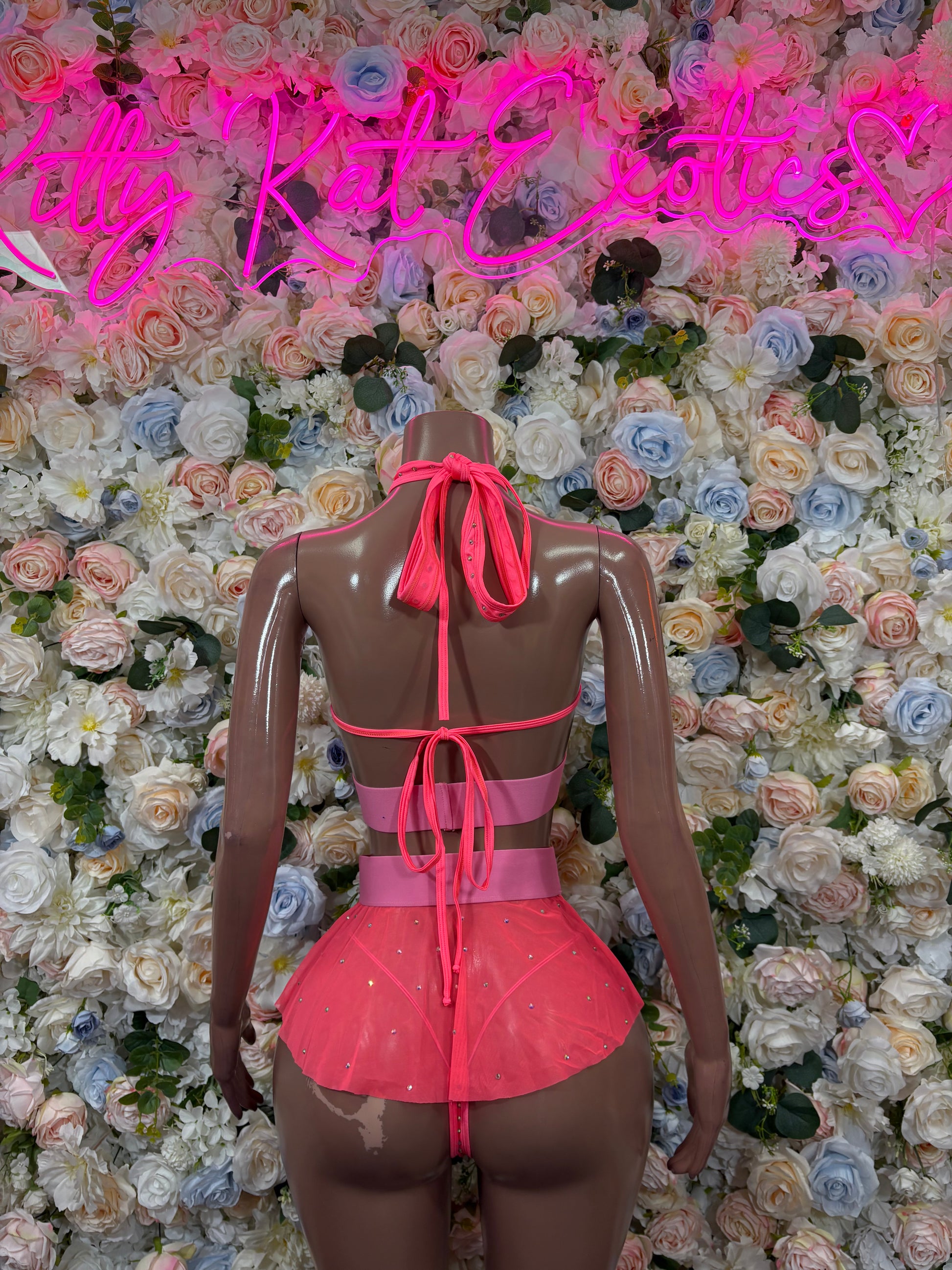 Coral back-view three-piece rave outfit with ruffled mini skirt and straps