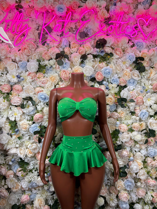 Green two-piece skirt set with bow bandeau top and pleated ruffle mini skirt