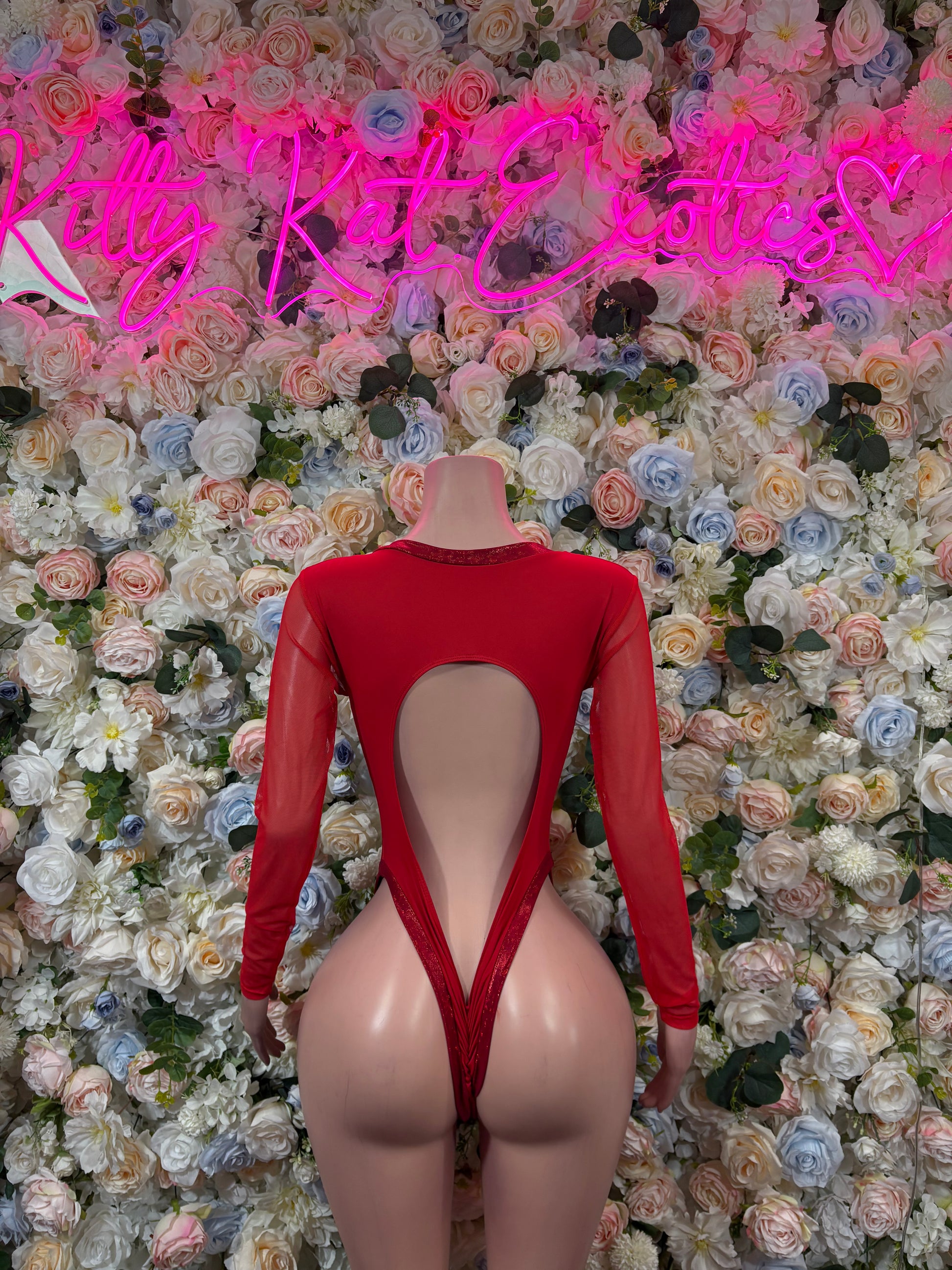 Red long-sleeve heart bodysuit with high-cut open back and straps