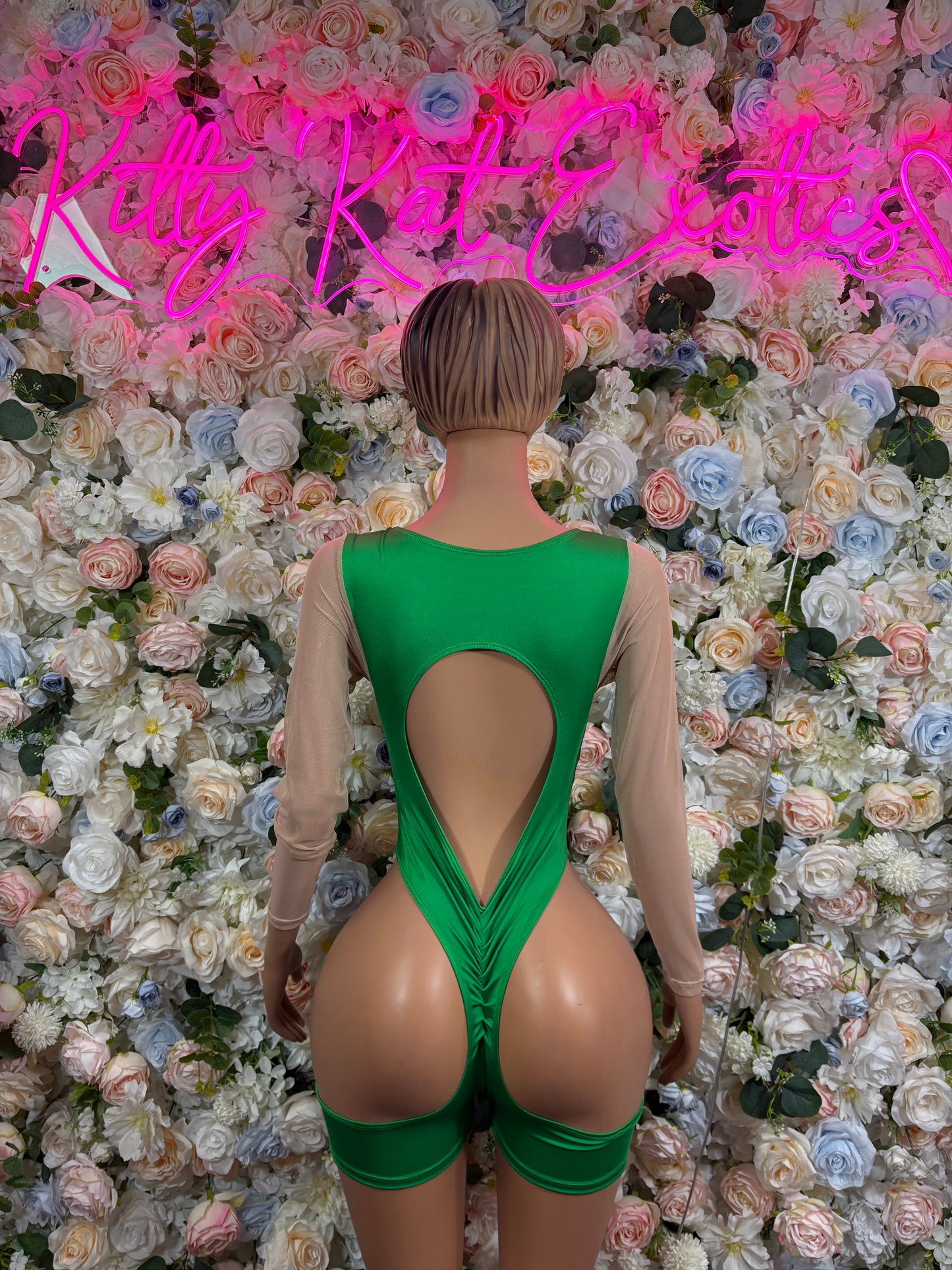 Green backless bodysuit with keyhole cutout at back and adjustable straps