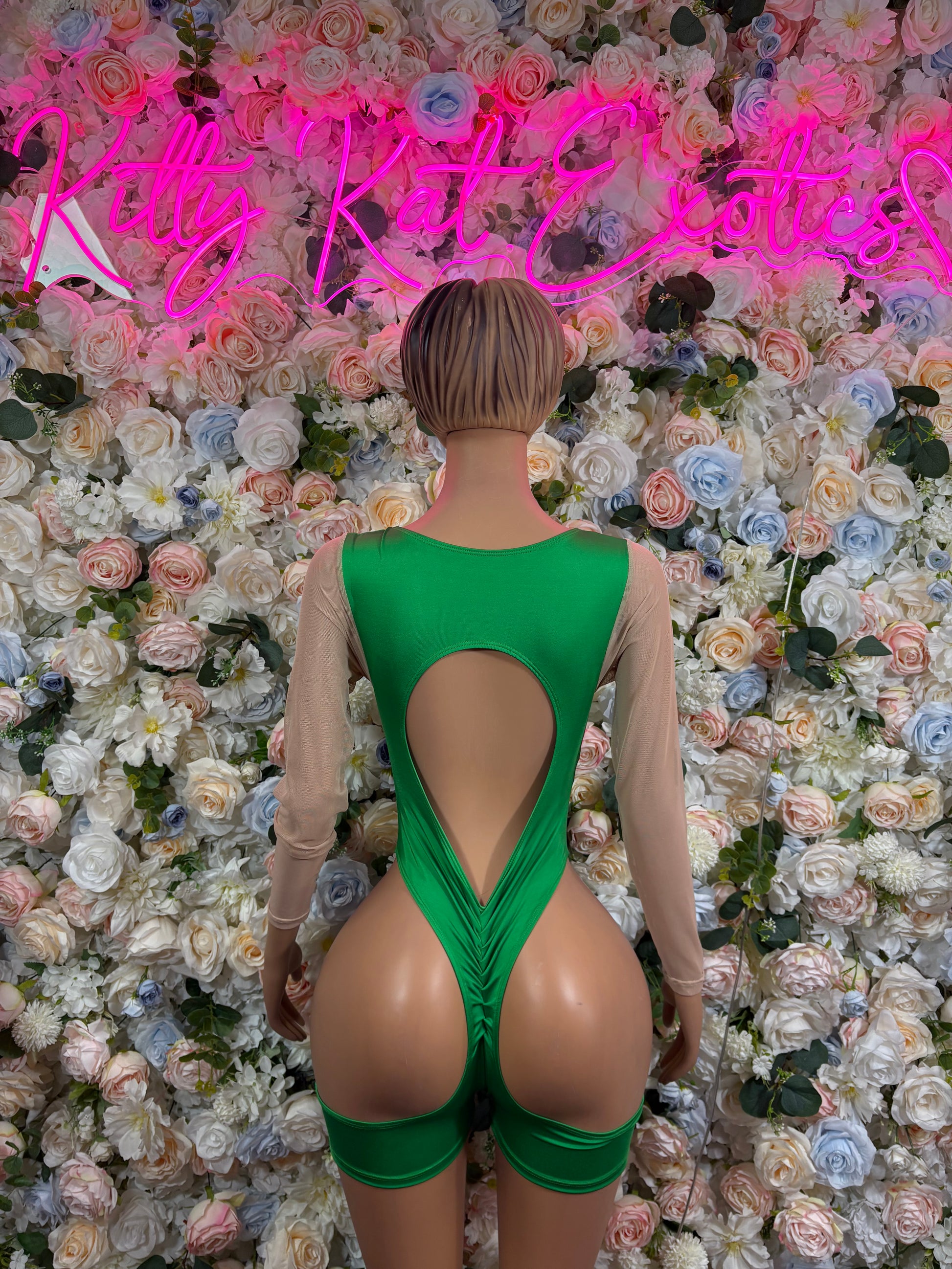 Green backless bodysuit with keyhole cutout at back and adjustable straps