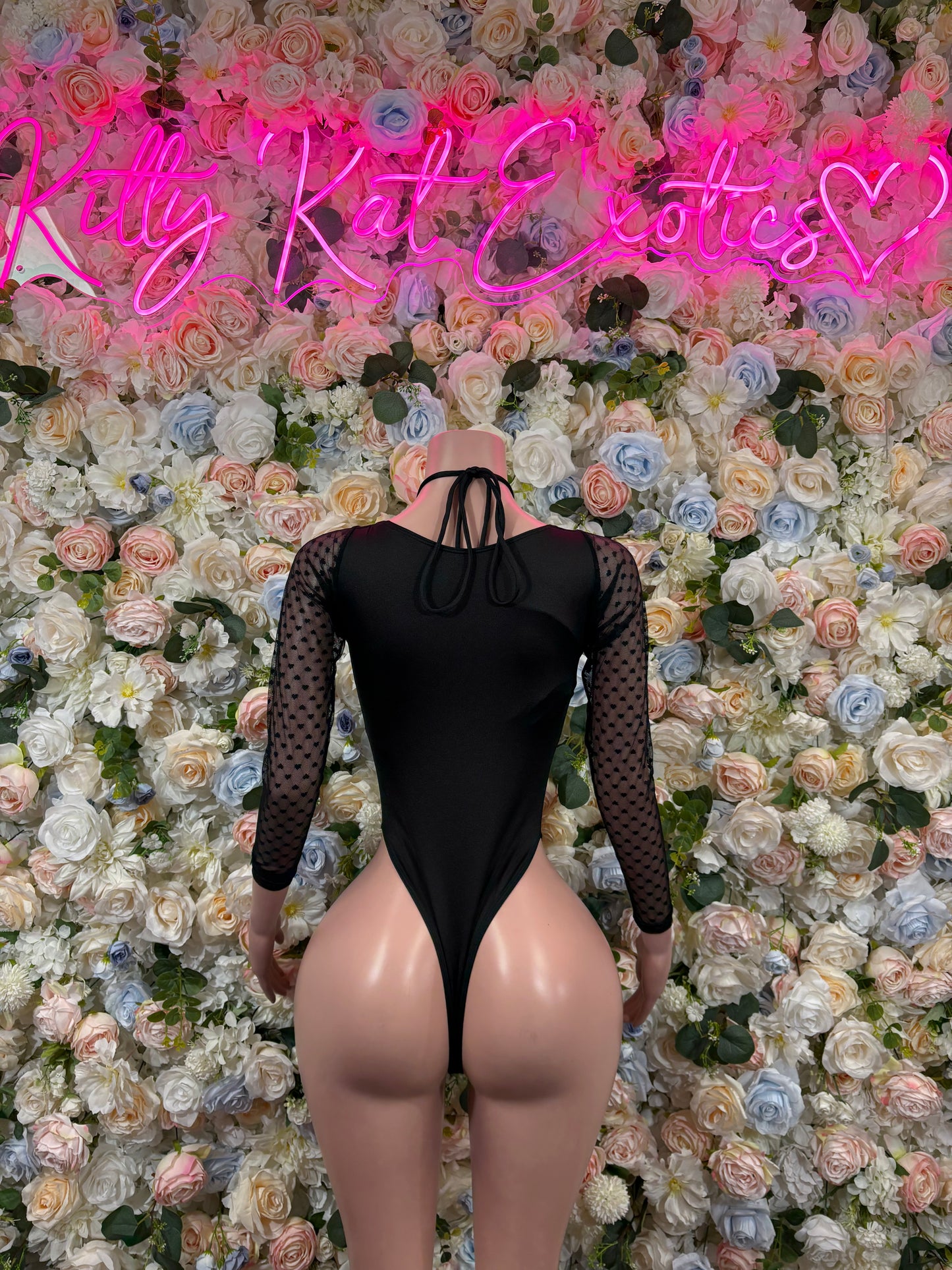 Black mesh long-sleeve bodysuit with lace-up back and open cutout