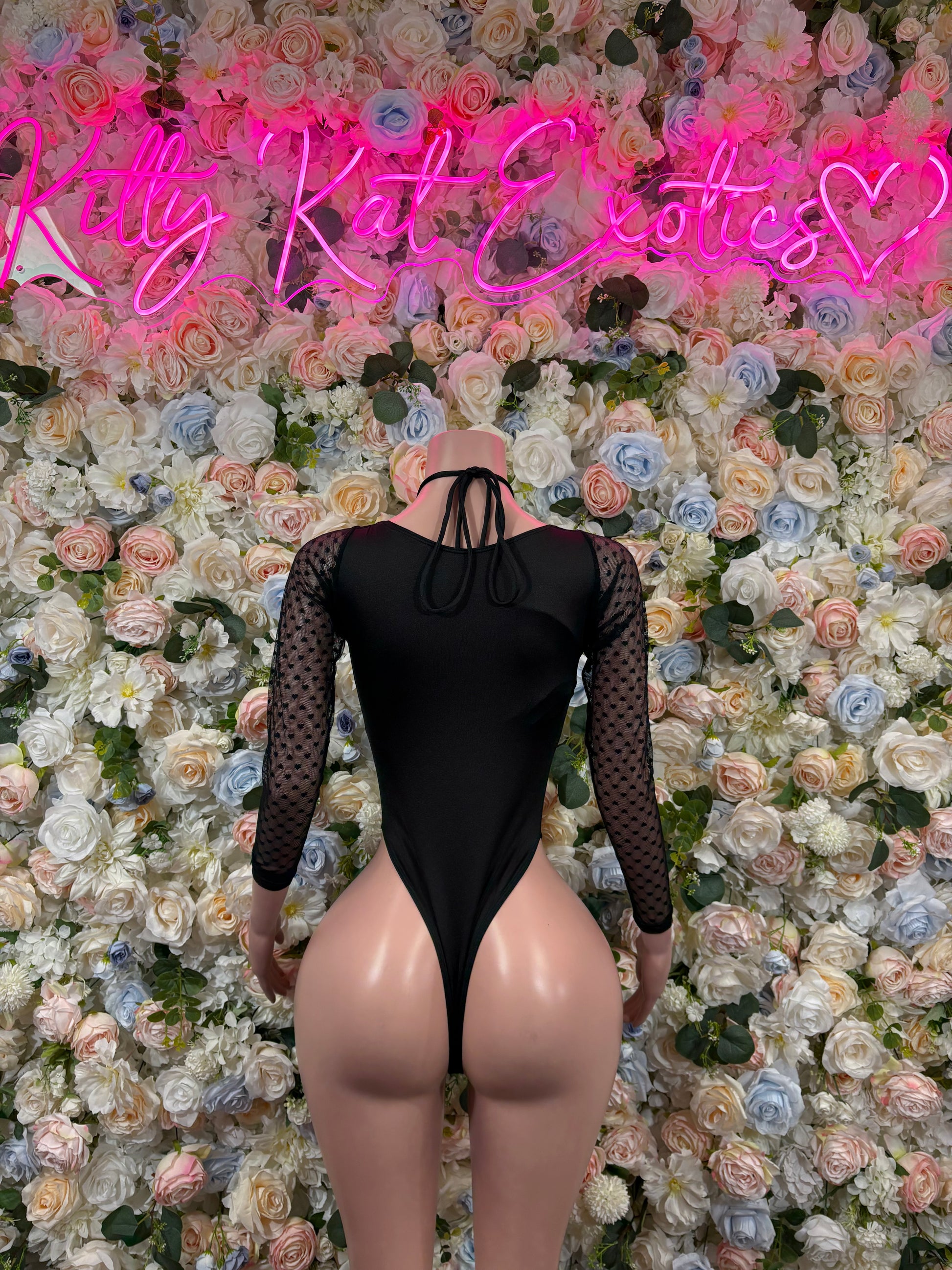 Black mesh long-sleeve bodysuit with lace-up back and open cutout