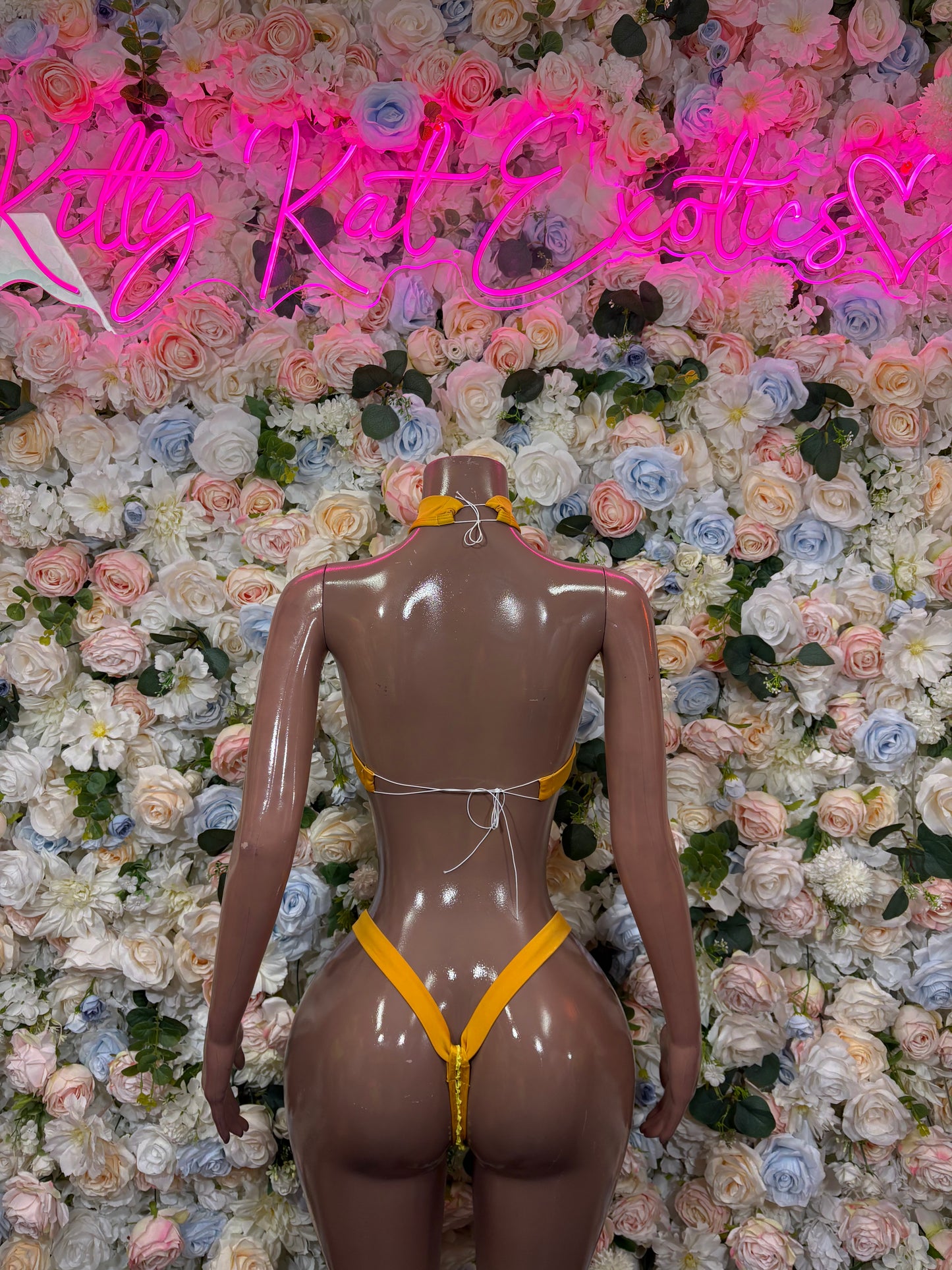 Back view orange bikini set with triangle top and string-style cheeky bottoms