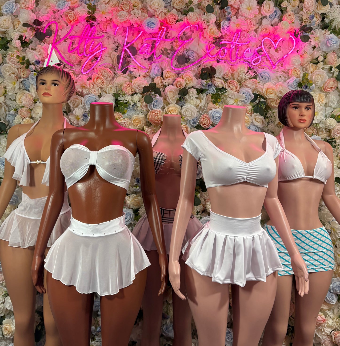 White strapless bra and pleated mini skirt two-piece set on multiple models