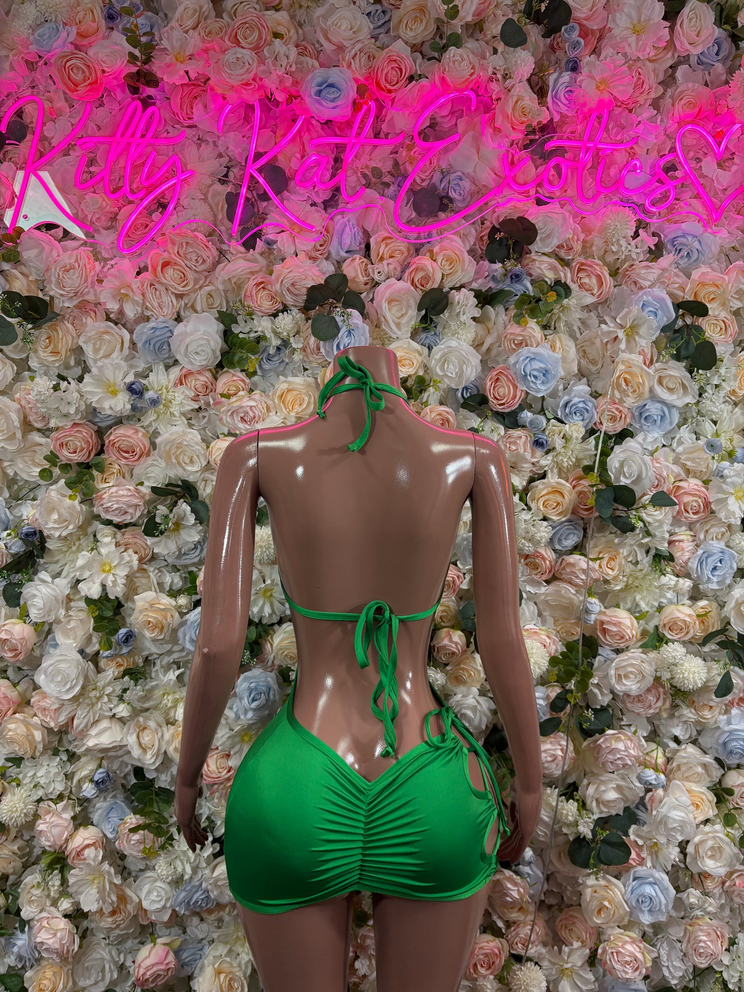 Green mini dress with tie straps and open back cutout
