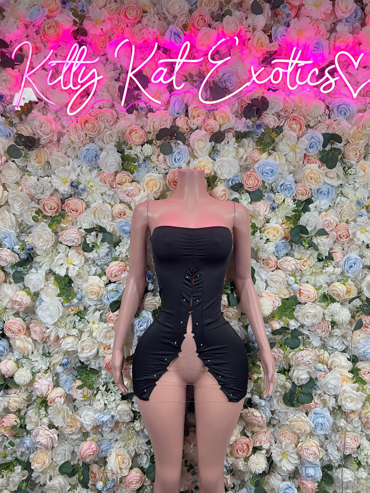 Black strapless mini dress with corset detailing and center slit