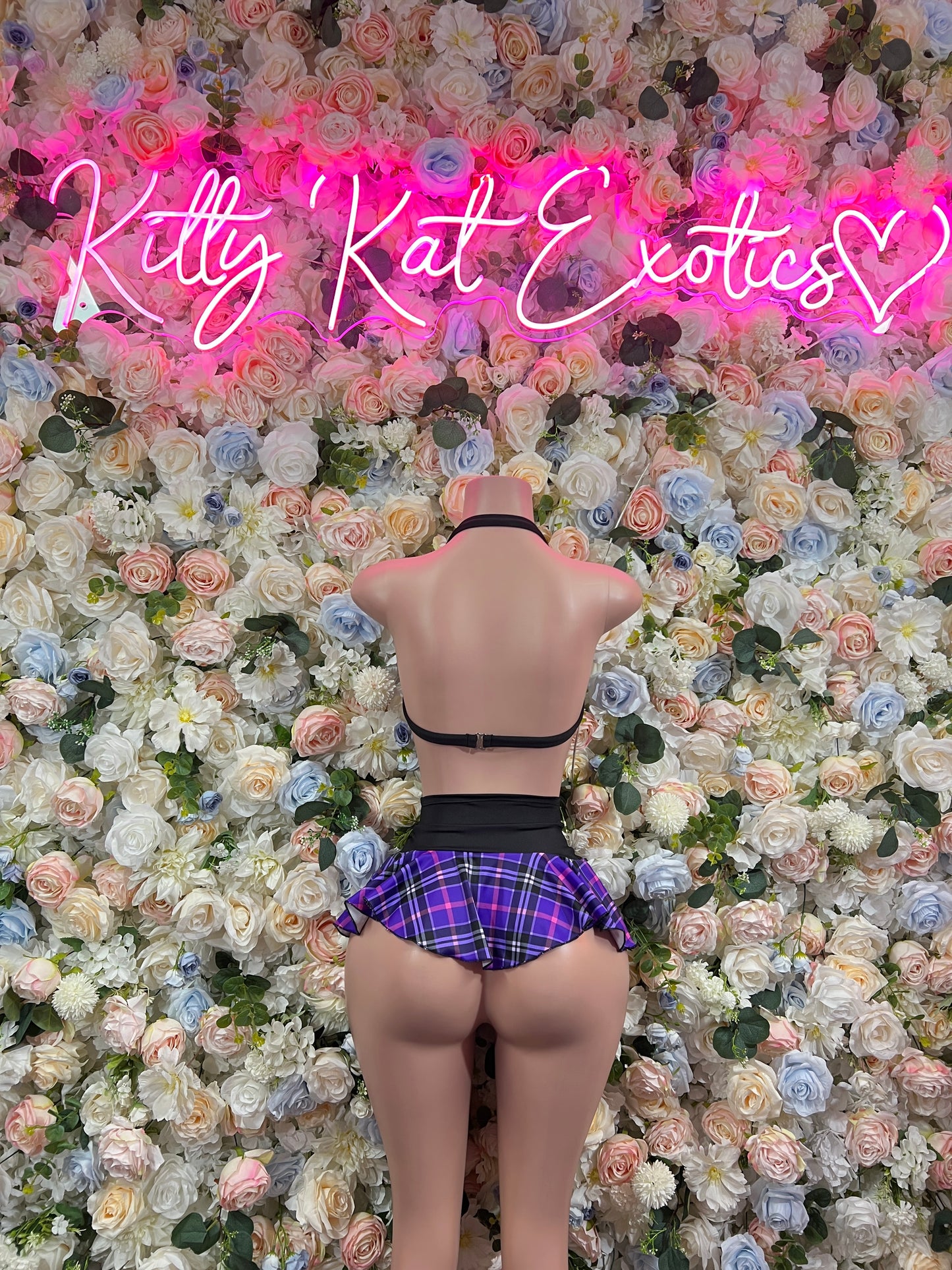 Purple plaid back view: crop top and mini skirt set with black trim