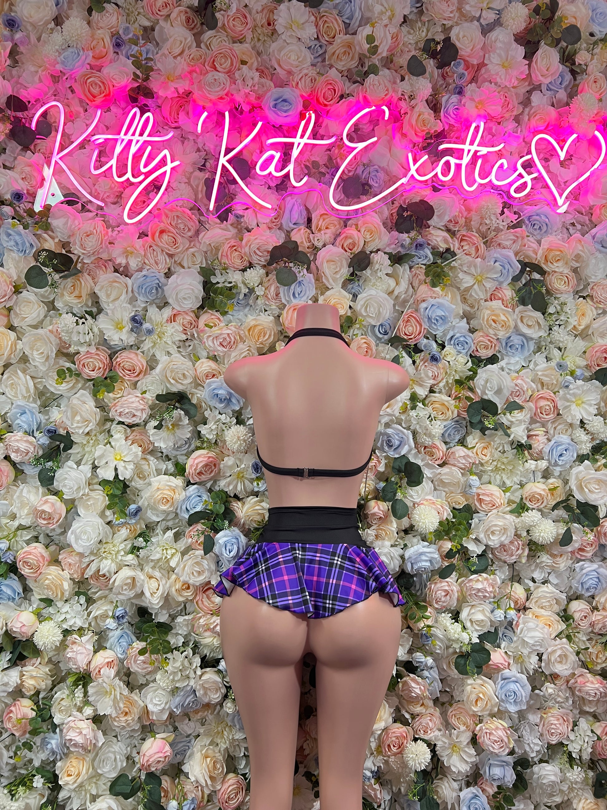 Purple plaid back view: crop top and mini skirt set with black trim