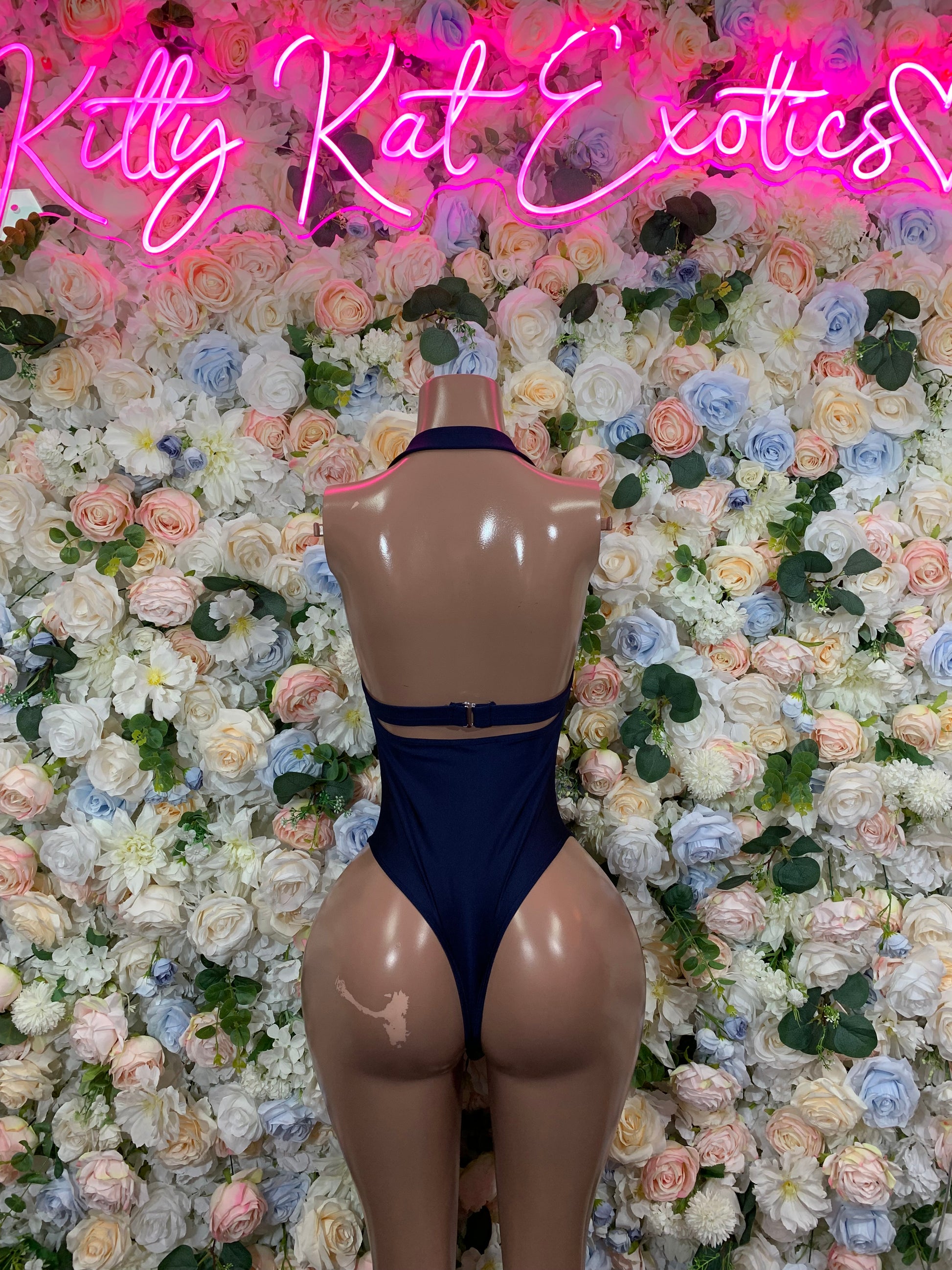 Blue one-piece bodysuit with high back and thin straps