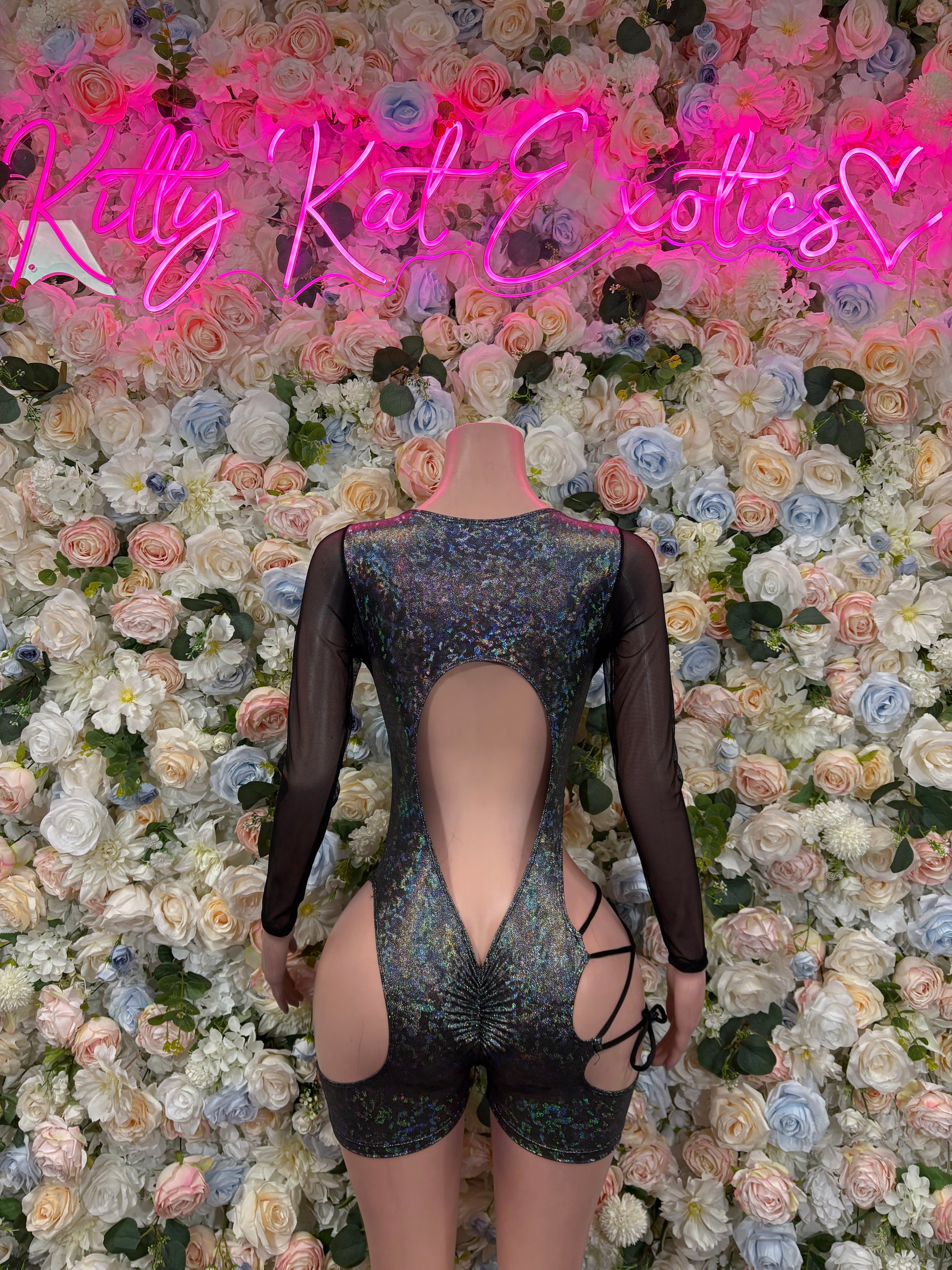 Black metallic long-sleeve bodysuit with open back and crisscross lace straps