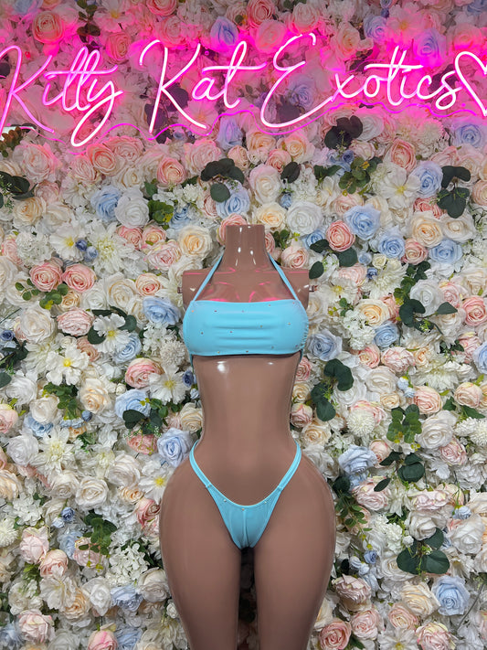 Light blue bandeau bikini top with halter straps and matching high-cut thong
