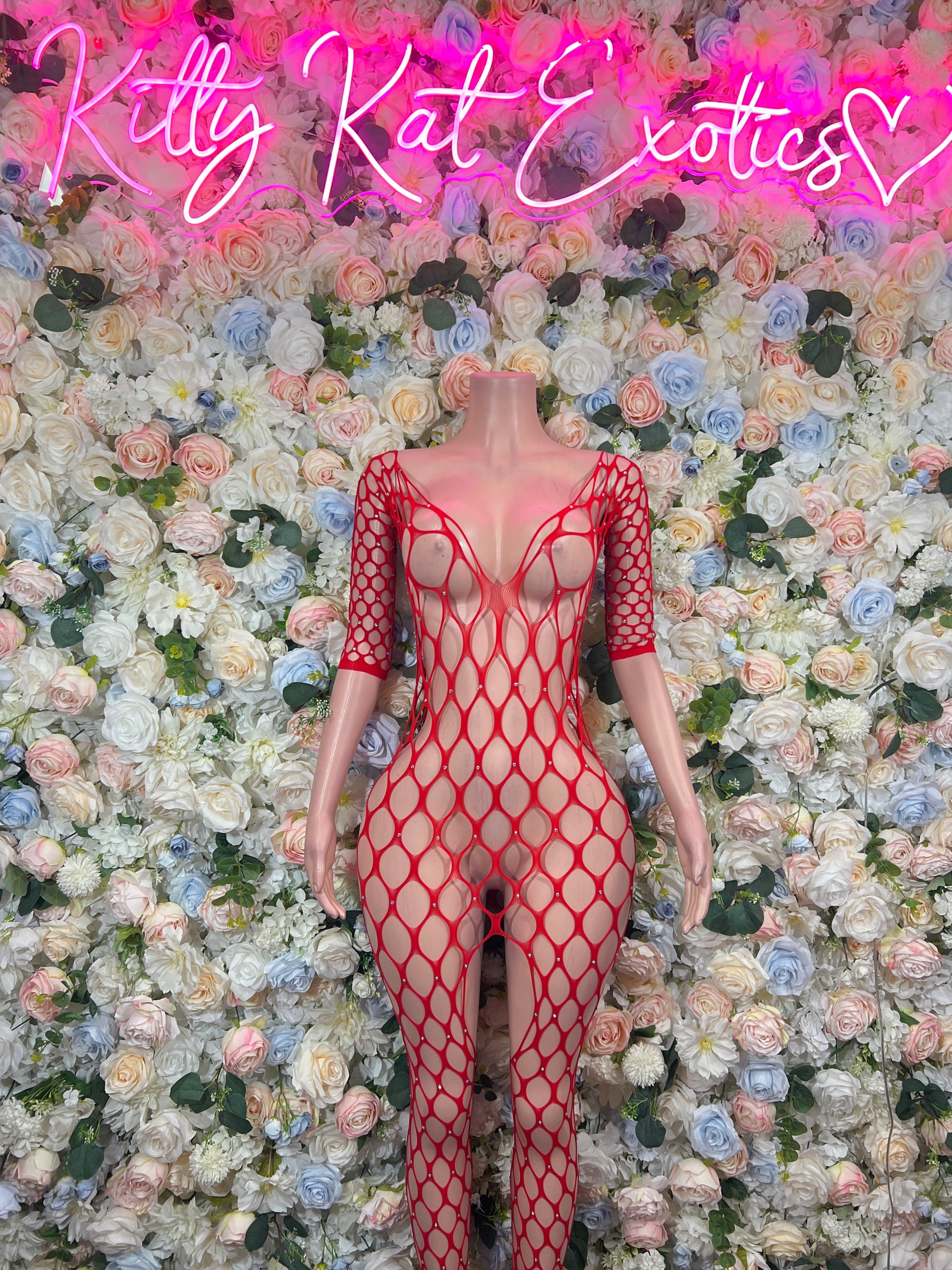 Red fishnet bodysuit with long sleeves and crisscross open-back straps