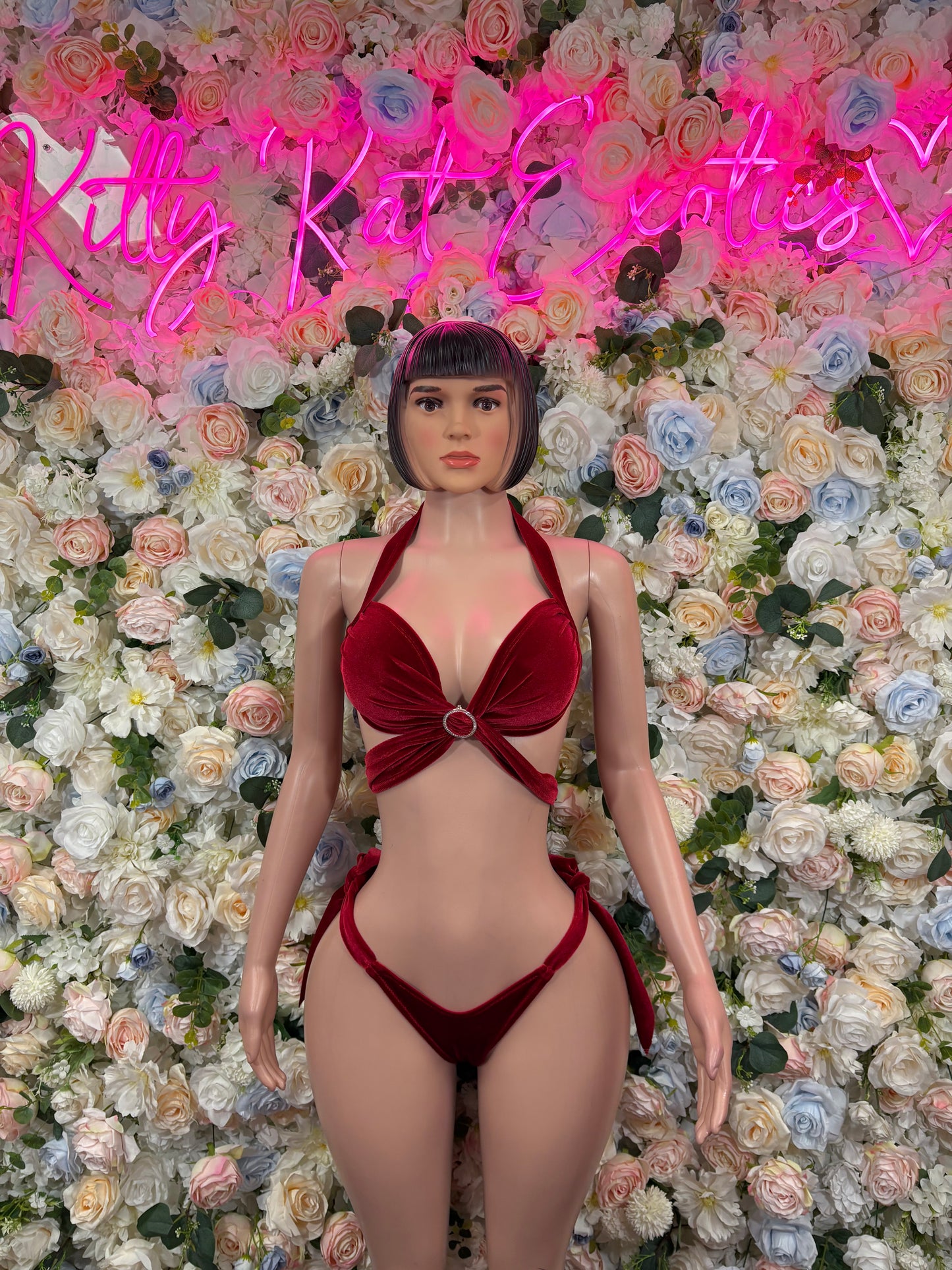 Red velvet two-piece outfit with plunging bra top and matching high-cut bottoms