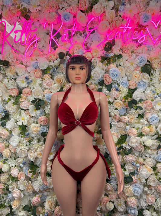 Red velvet two-piece outfit with plunging bra top and matching high-cut bottoms