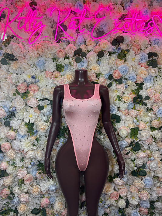 Pink rhinestone one-piece dance bodysuit, high-cut front, on mannequin
